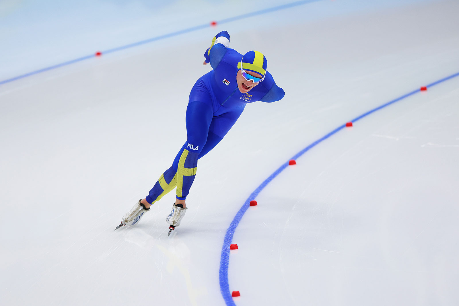Sweden's Nils van der Poel skates on the way to a new world record during the men's 10,000m speed skating event on February 11.