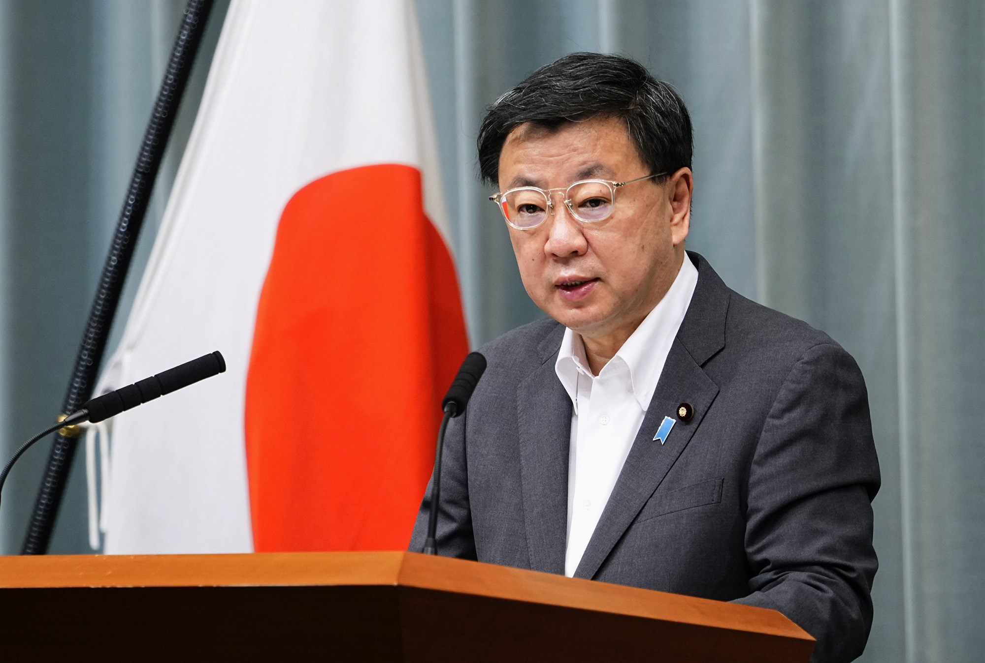 Japanese Chief Cabinet Secretary Hirokazu Matsuno speaks during a news conference in Tokyo on June 13.