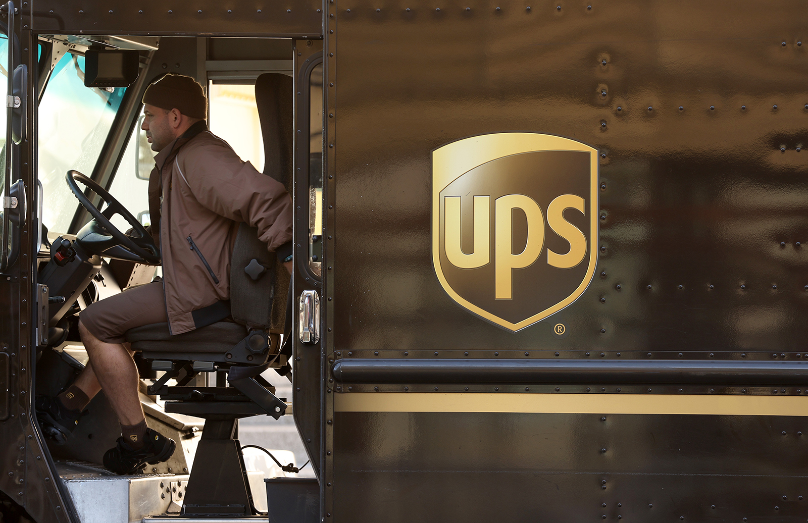 A United Parcel Service (UPS) driver sits in his delivery truck on January 31, 2023 in San Francisco, California. 