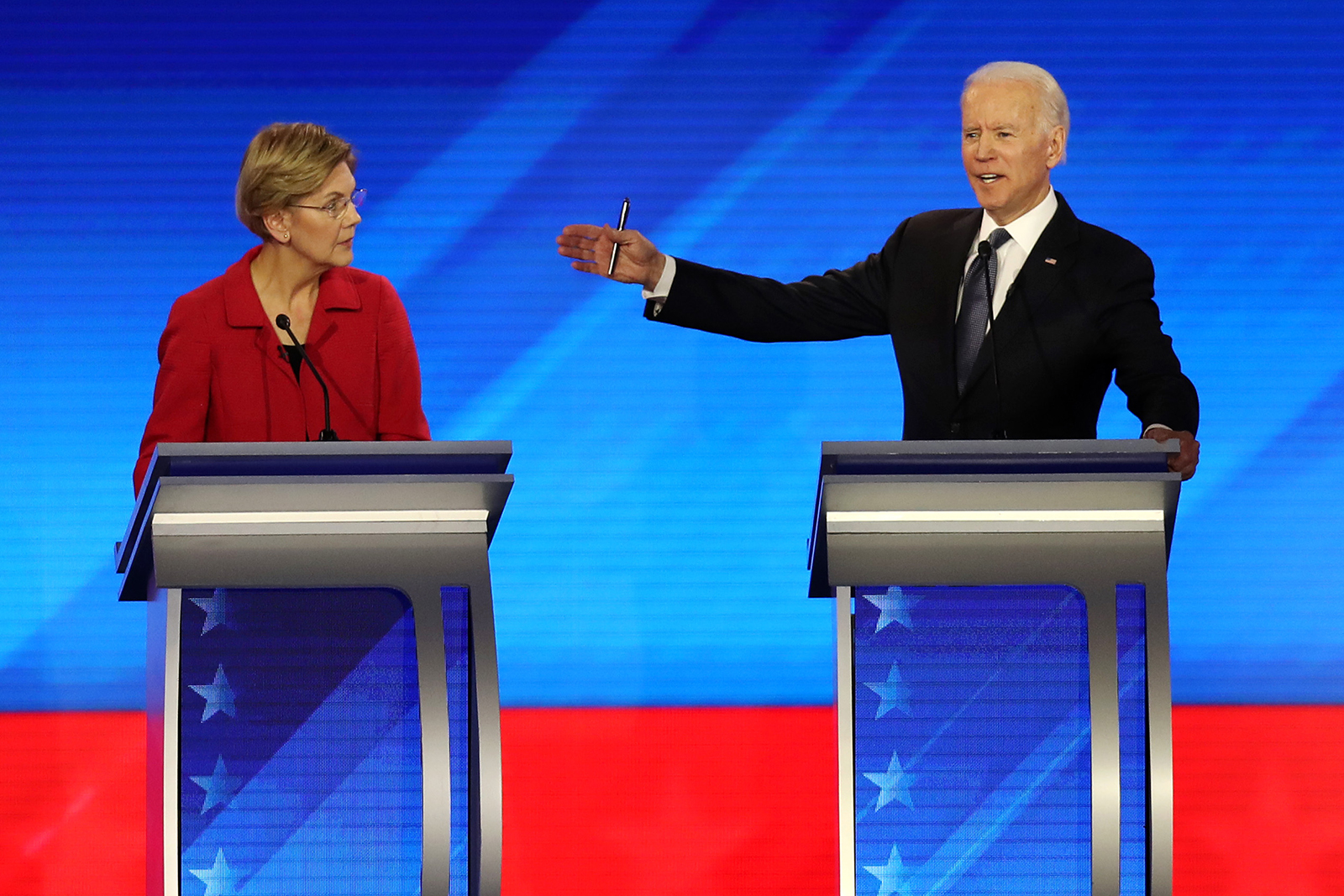 Democratic presidential candidates Sen. Elizabeth Warren and former Vice President Joe Biden participate in the Democratic presidential primary debate in the Sullivan Arena at St. Anselm College on February 7, in Manchester, New Hampshire.