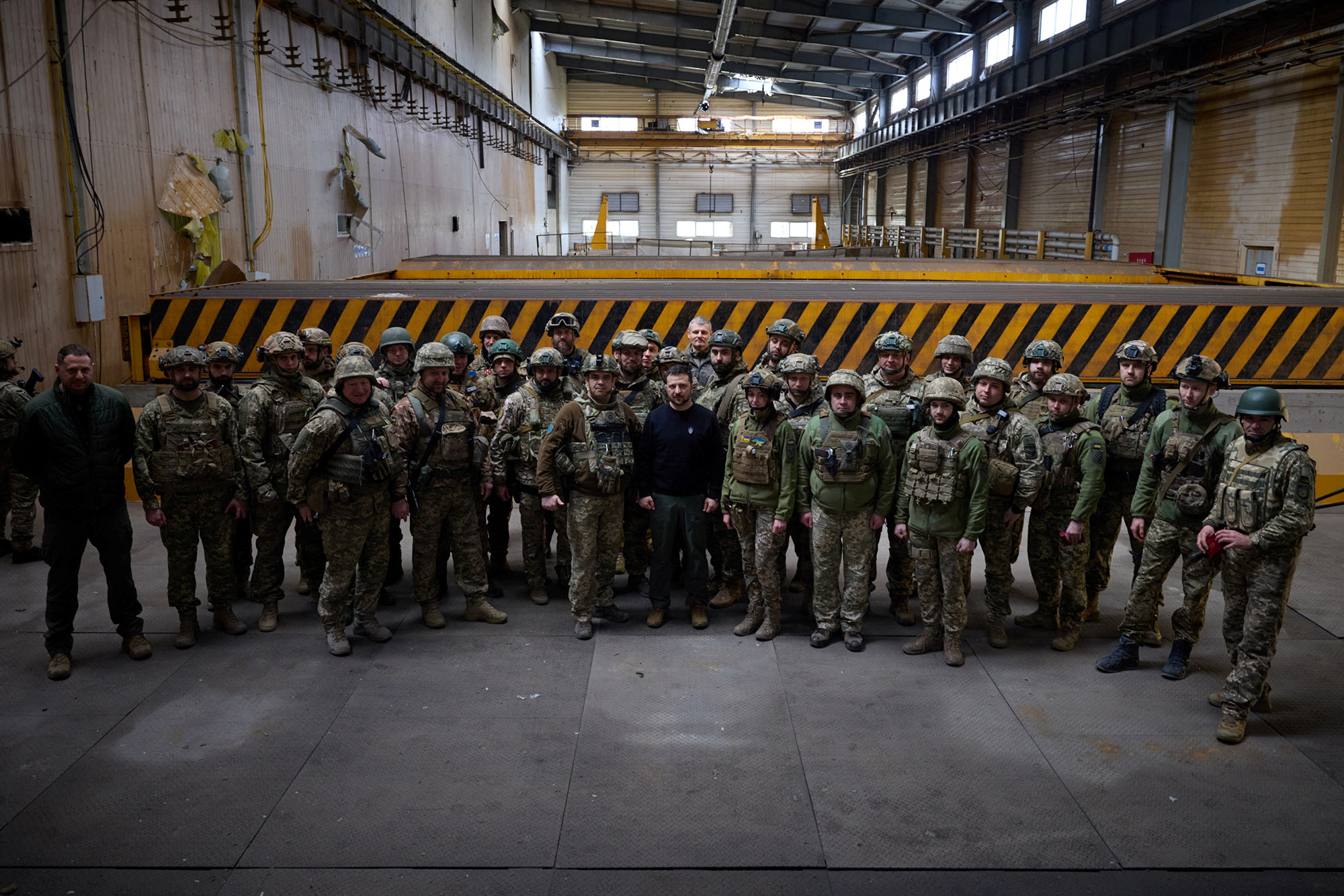 Ukraine's President Volodymyr Zelensky, center, poses for a picture with Ukrainian service members at a frontline in Avdiivka, Donetsk region, Ukraine, on April 18.