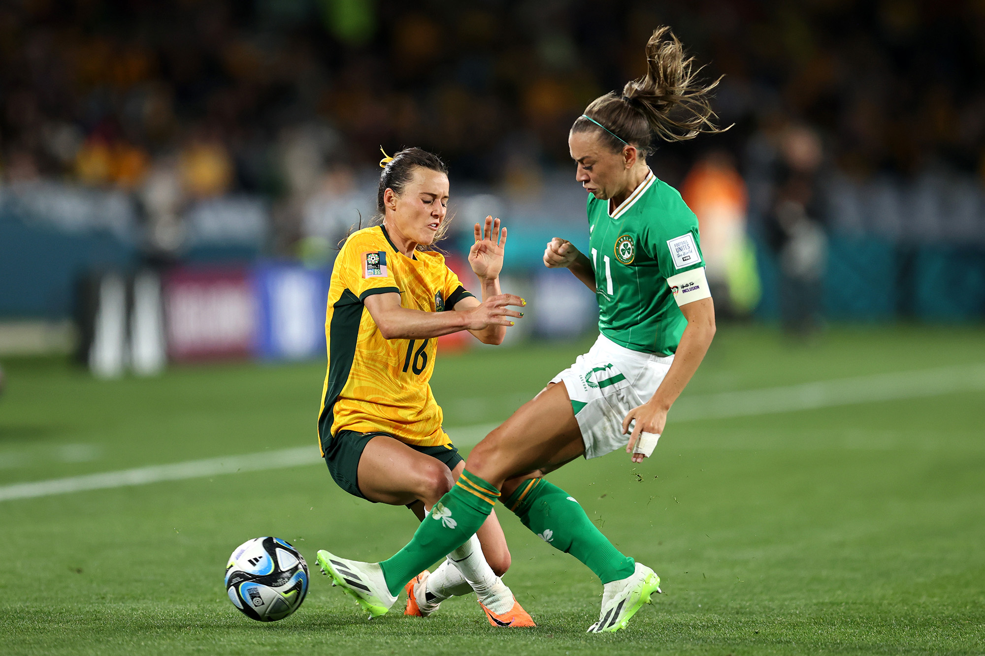 Hayley Raso of Australia, left, and Katie McCabe of Republic of Ireland compete for the ball during the Group B match between Australia and Ireland at Stadium Australia on July 20.
