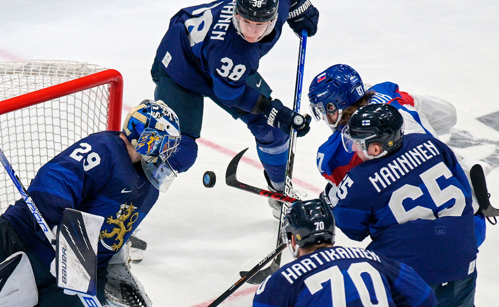 Finnish goalie Harri Säteri defends his net during a hockey semifinal against Slovakia on February 18. Finland won 2-0.