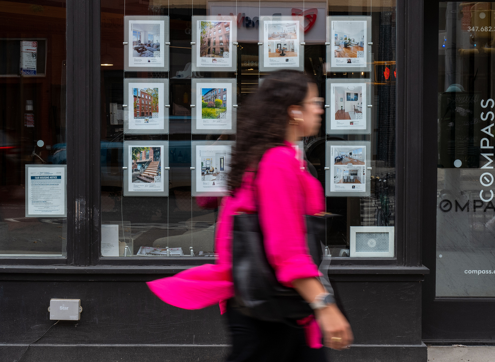 Rental apartments are displayed in a realtor's office window on July 26, 2022 in the Brooklyn borough of New York City. 