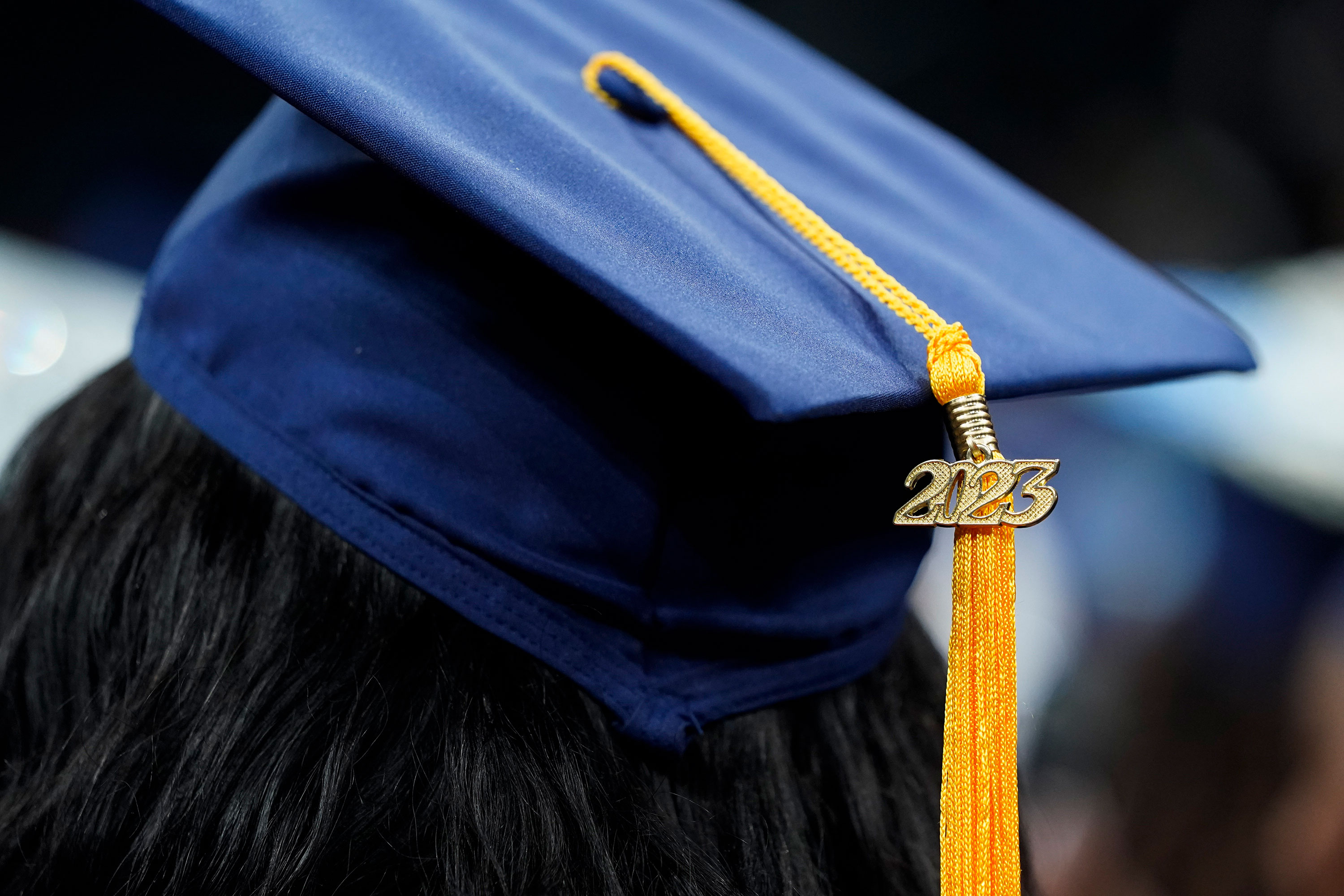 A 2023 tassel rests on a graduation cap as students walk in a procession for Howard University's commencement in Washington, DC, on May 13. 