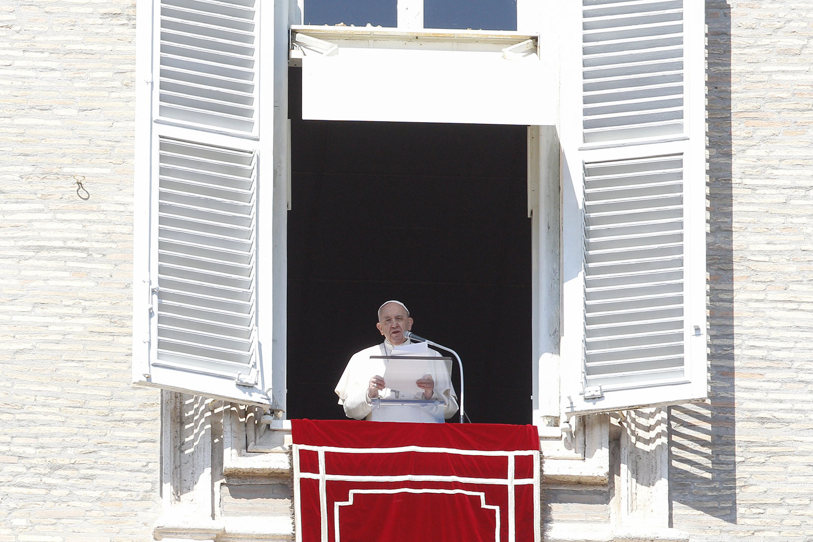 Pope Francis recites a prayer at the Vatican on March 13.