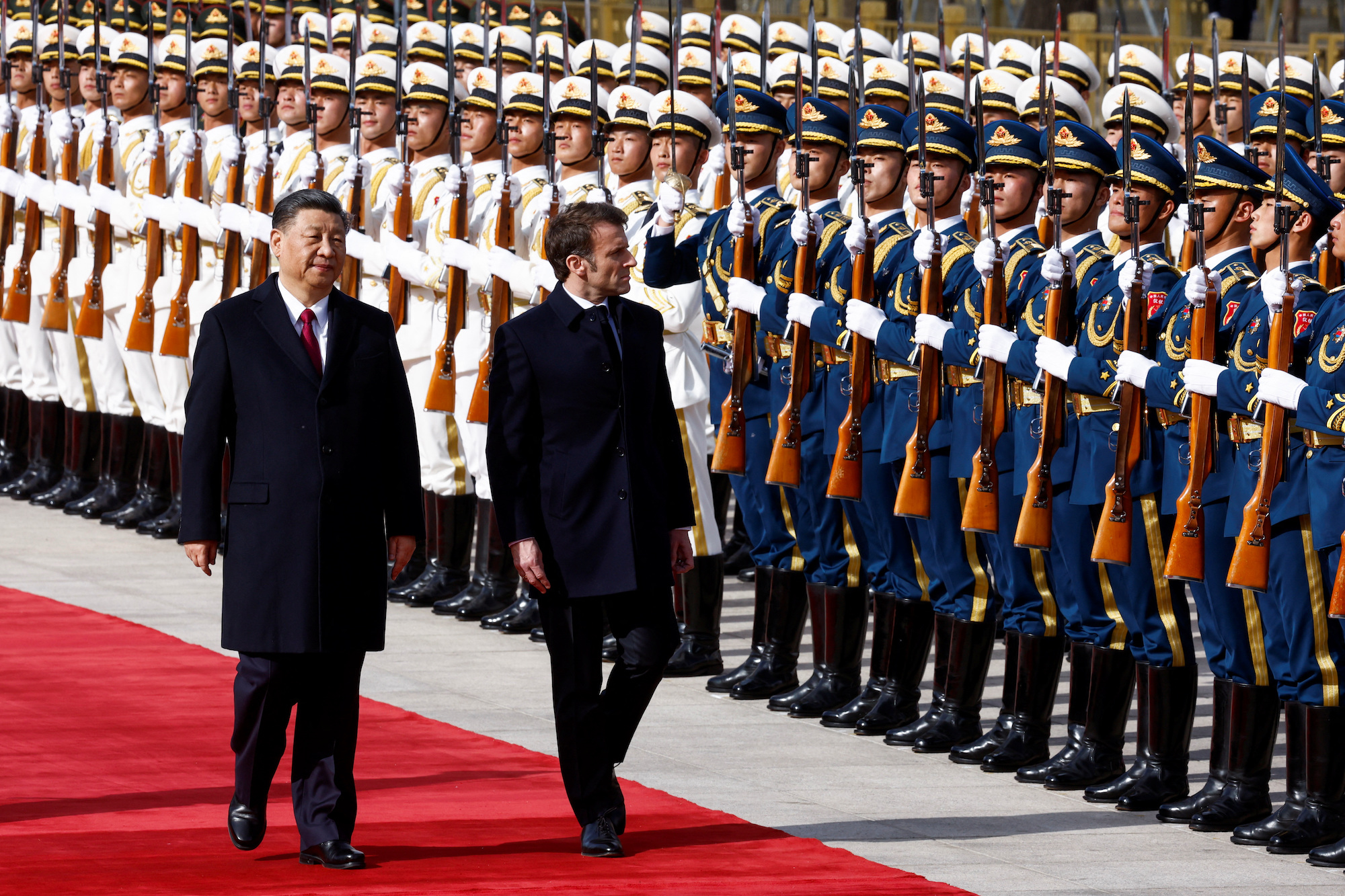 Chinese President Xi Jinping and French President Emmanuel Macron review troops in Beijing on Thursday.