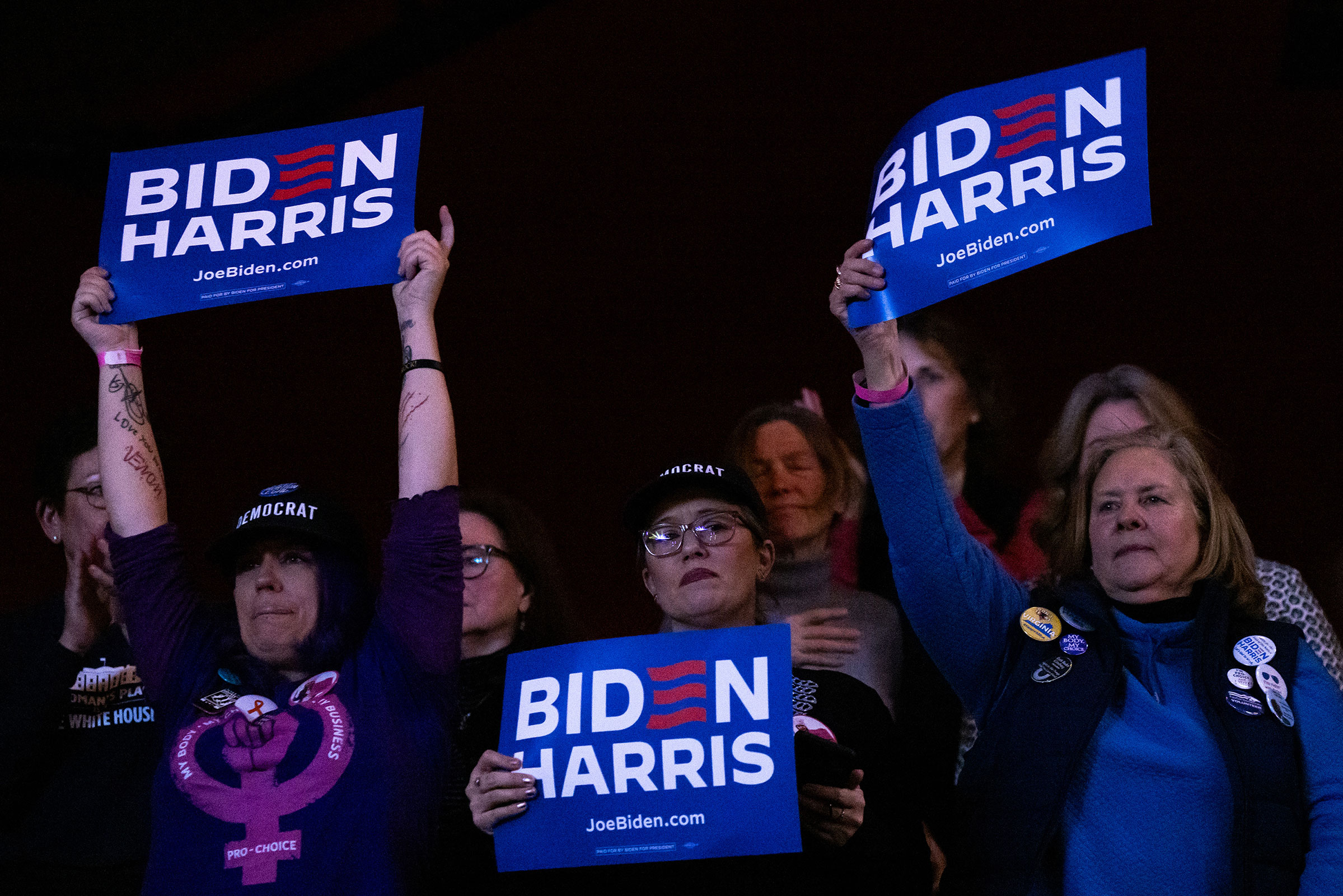 Attendees hold signs during a reproductive freedom campaign rally with US President Joe Biden and Vice President Kamala Harris at George Mason University in Manassas, Virginia, on Tuesday, January 23.