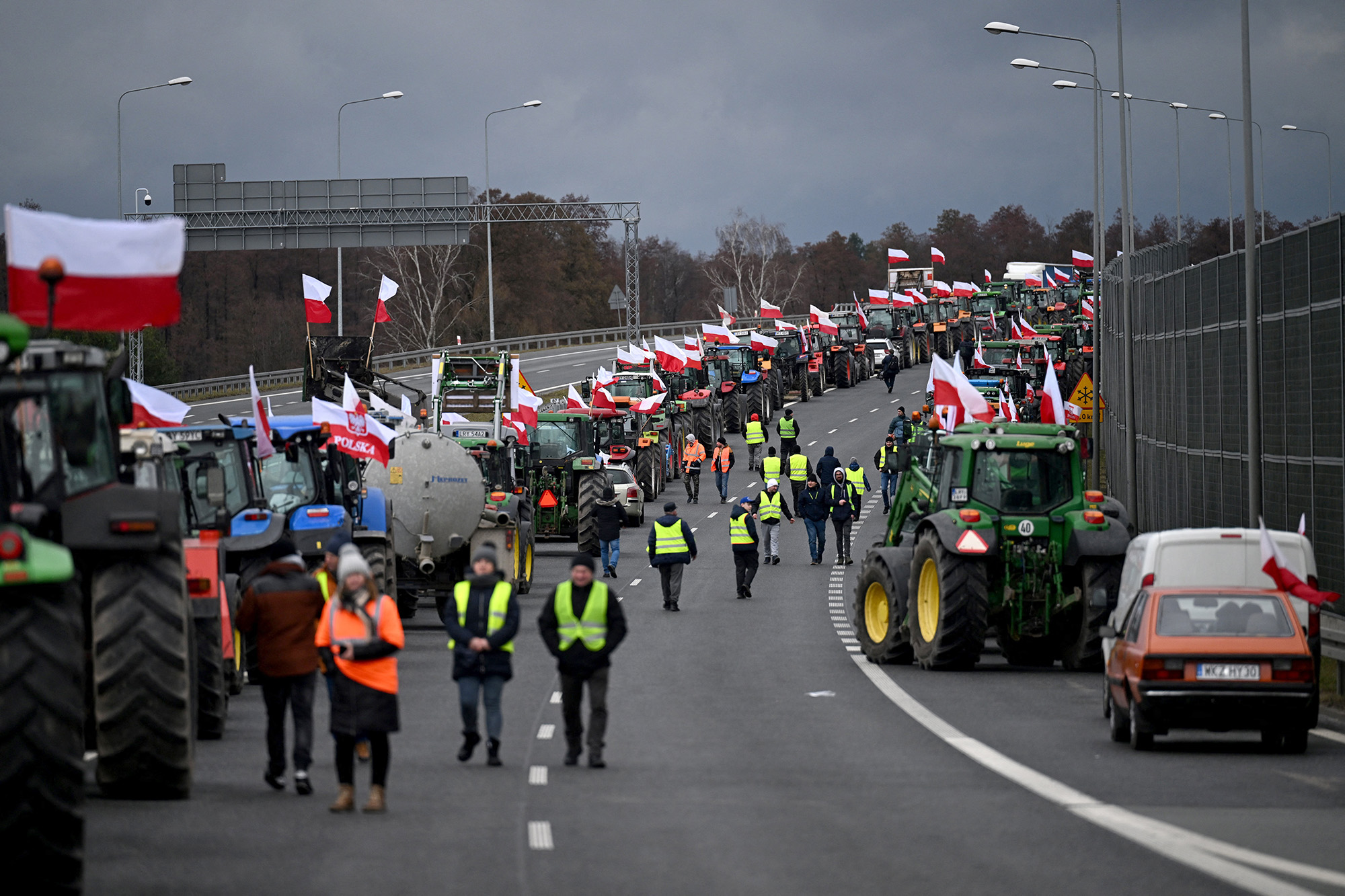 Polish farmers with their tractors and vehicles block the highway linking Warsaw and Lublin outside the town of Ryki, Poland, during a protest of farmers across the country against EU climate measures on February 20.