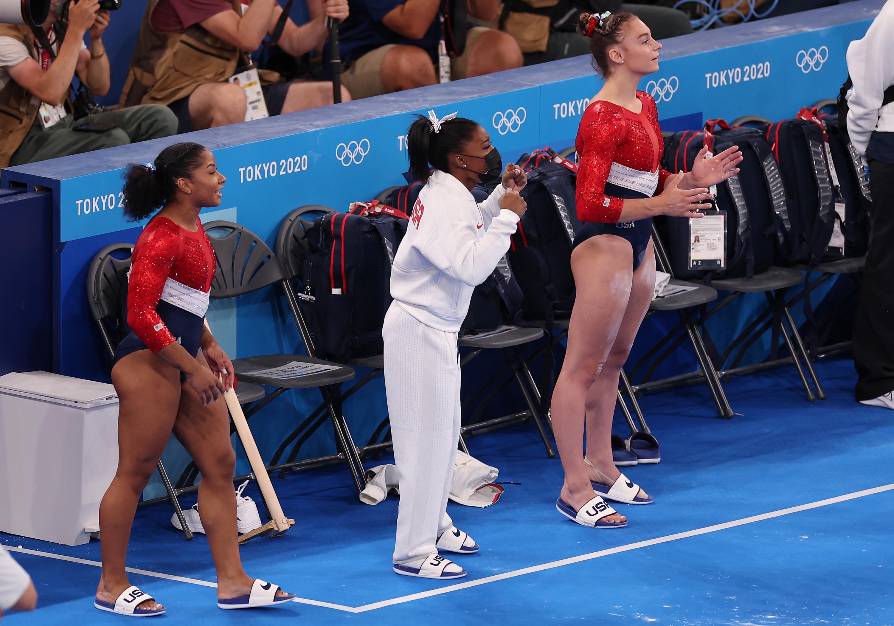 From left: Jordan Chiles, Simone Biles and Grace McCallum cheer on Sunisa Lee of Team United States as she competes on uneven bars on Tuesday.