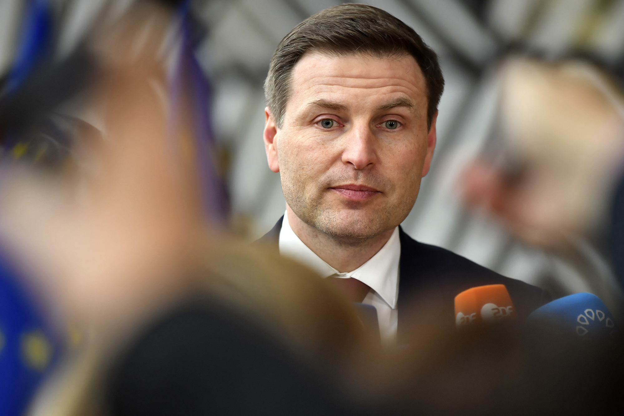 Estonia's Defense Minister Hanno Pevkur speaks with the media as he arrives for a meeting of EU foreign and defense ministers at the European Council building in Brussels, Belgium, on March 20.