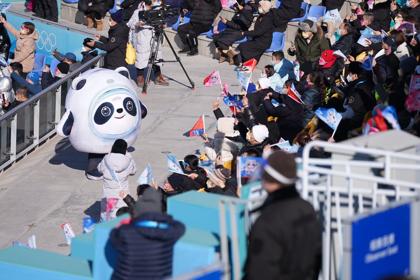 Beijing 2022 mascot Bing Dwen Dwen entertains the crowds on Tuesday at the women's big air event.