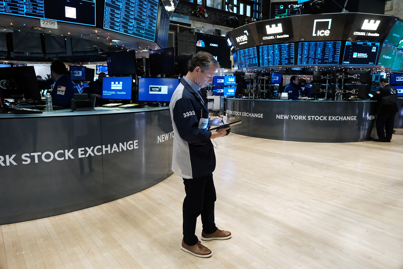 Traders work on the floor of the New York Stock Exchange on December 13. 