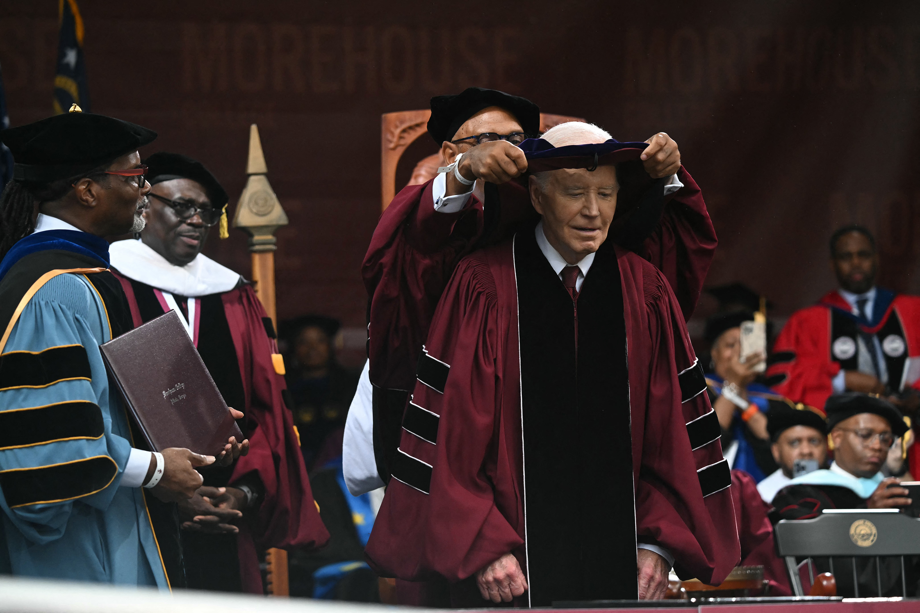 President Joe Biden is given an honorary degree after delivering his commencement address at Morehouse College in Atlanta on May 19.