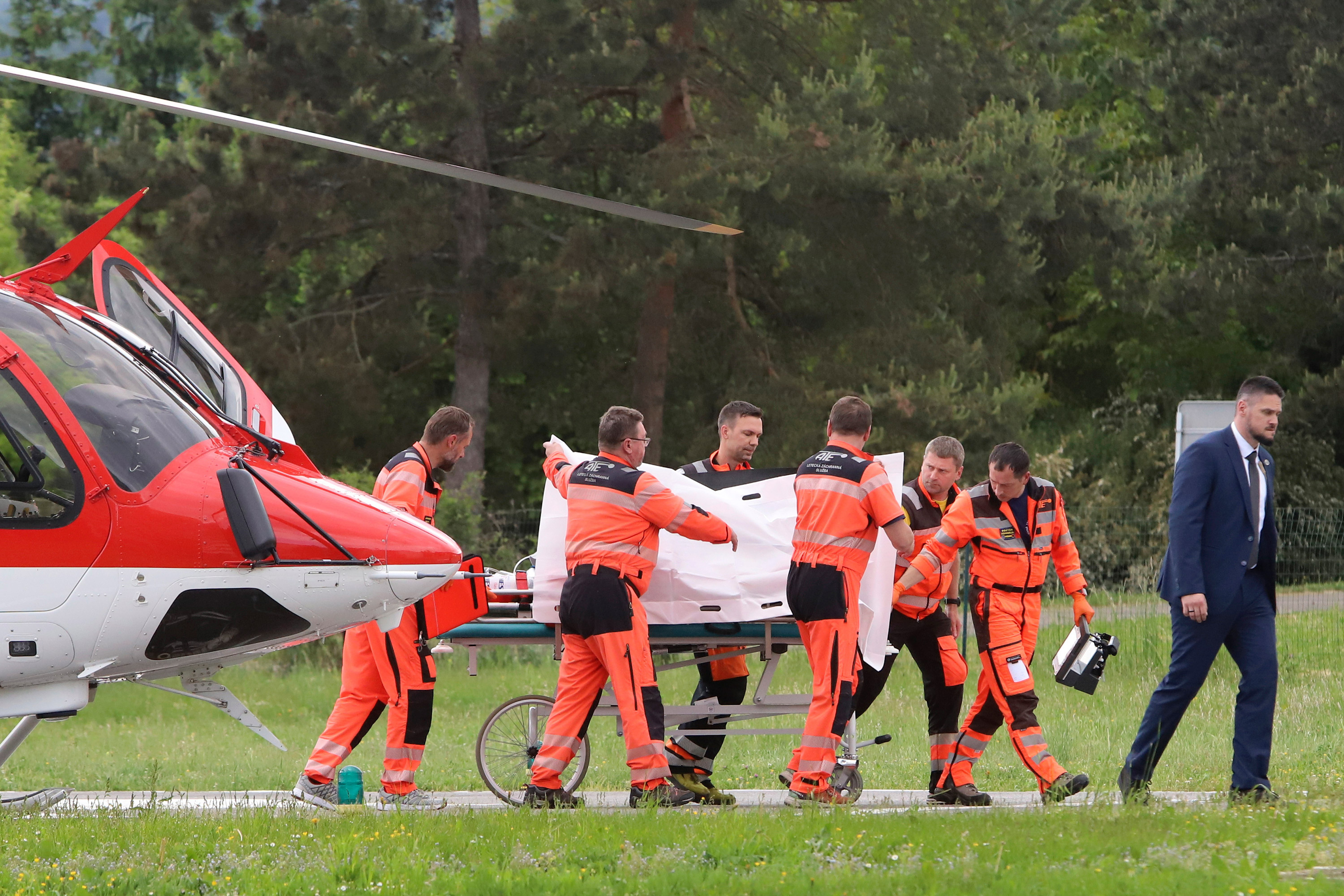 Rescue workers wheel Slovak Prime Minister Robert Fico from a helicopter to a hospital in Banska Bystrica, Slovakia, on Wednesday.