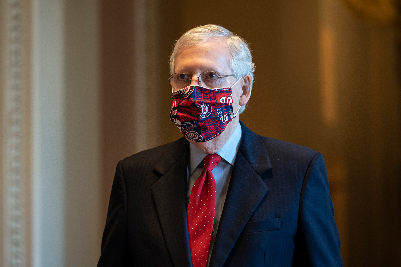 Senate Majority Leader Mitch McConnell walks to the Senate floor at the U.S. Capitol on July 30 in Washington.