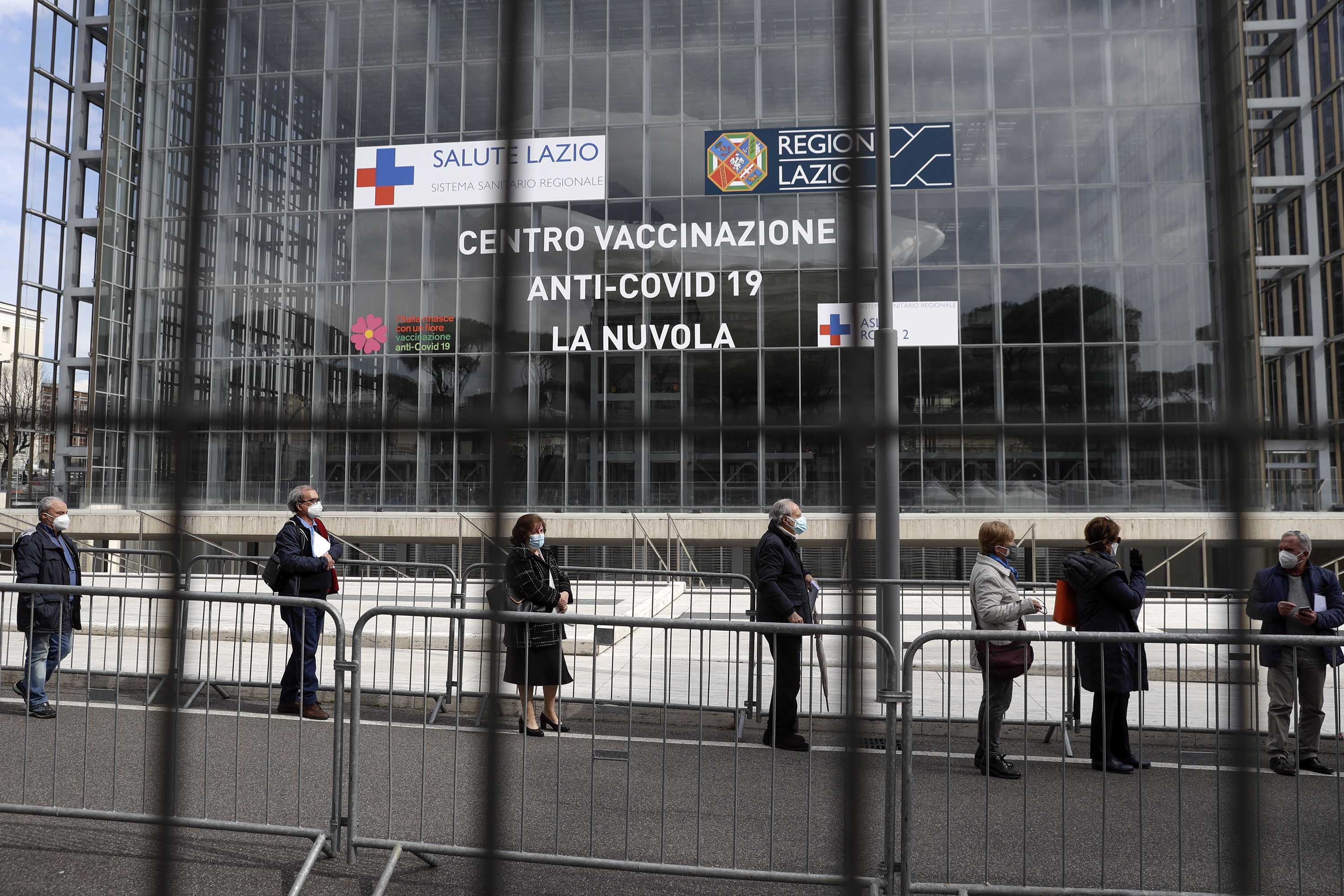 People queue to receive the AstraZeneca vaccine in Rome, Italy, on March 19. 