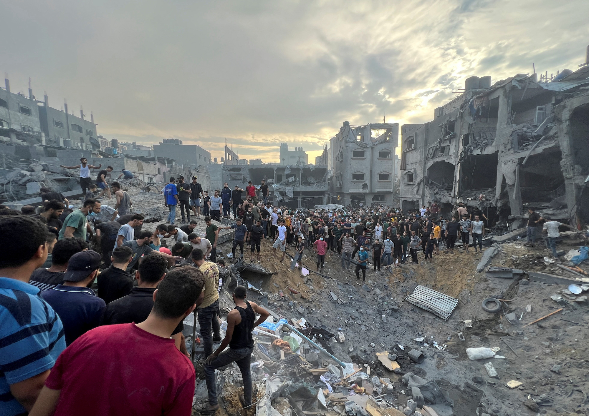 Palestinians search for casualties at the site of a strike at the Jabalya refugee camp in Gaza on Tuesday.