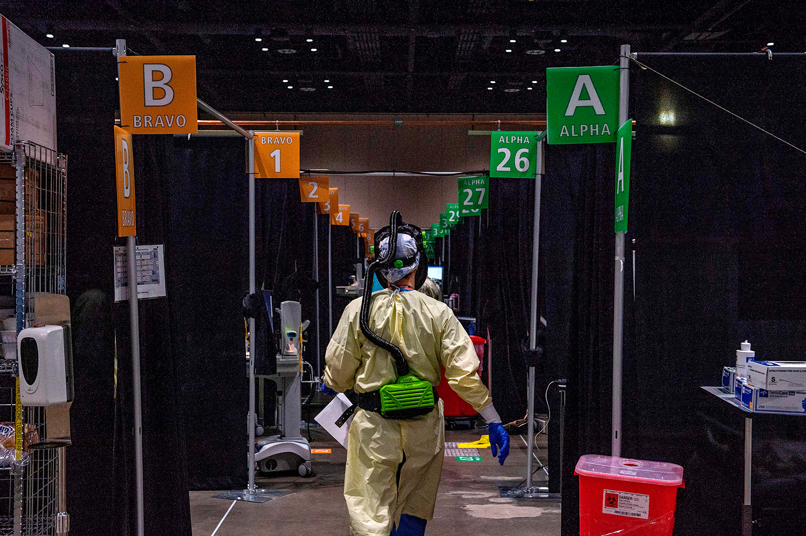 Inside the hot zone, medical staff monitor and treat sick patients infected with the Covid-19 virus at the UMASS Memorial DCU Center Field Hospital in Worcester, Massachusetts, on January 13