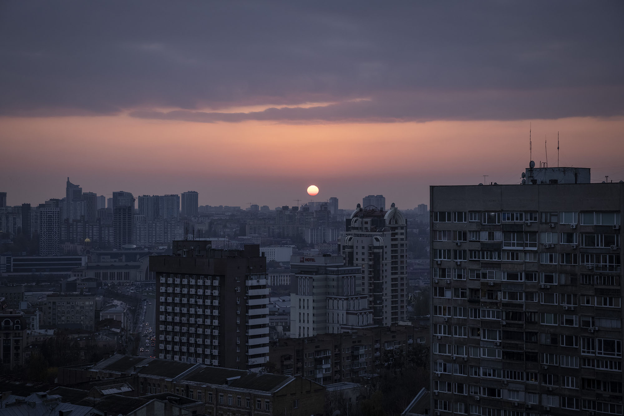 The sun sets over the west of Kyiv on November 7 as electricity and heating outages across Ukraine continue.