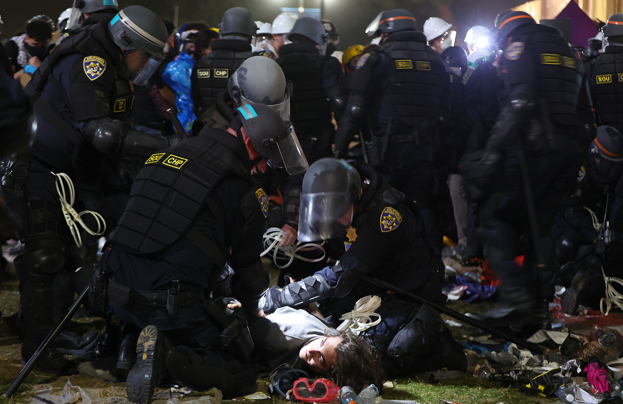 Law enforcement officers detain a protester at UCLA on May 2. 