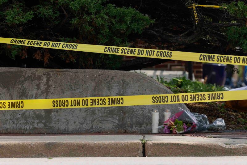Flowers lay near the scene of the shooting in Highland Park, Illinois, on Tuesday.