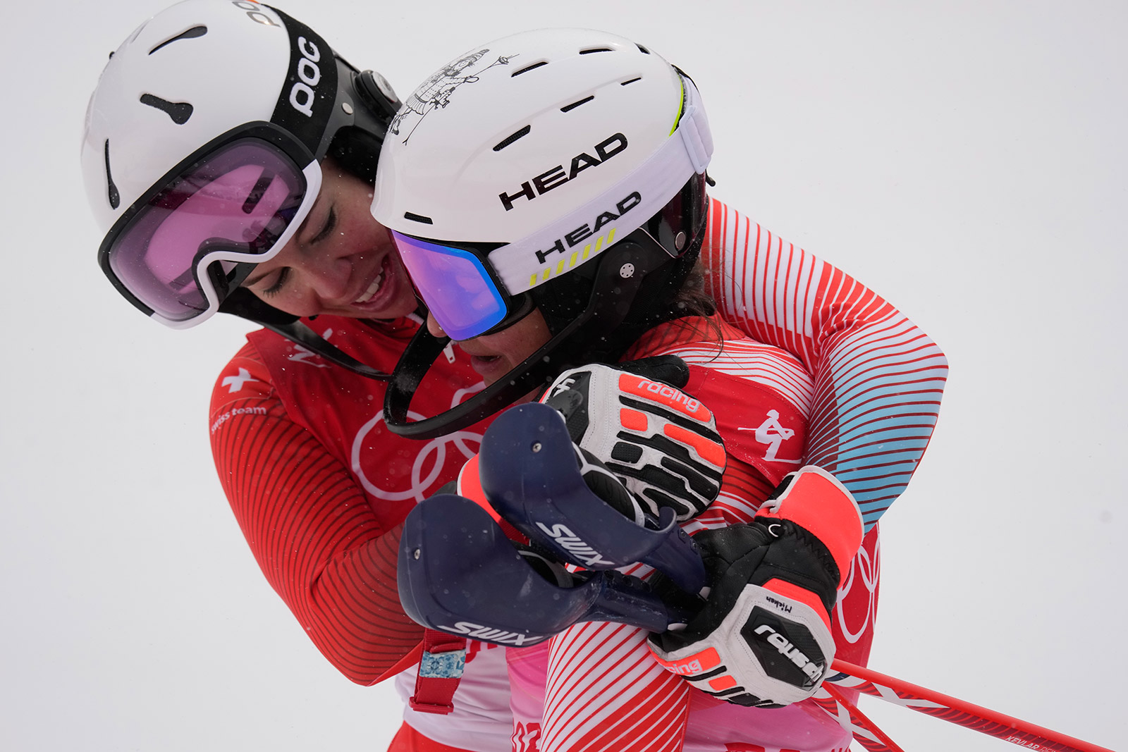 Switzerland's Michelle Gisin embraces teammate Wendy Holdener after finishing the women's combined slalom on Thursday.