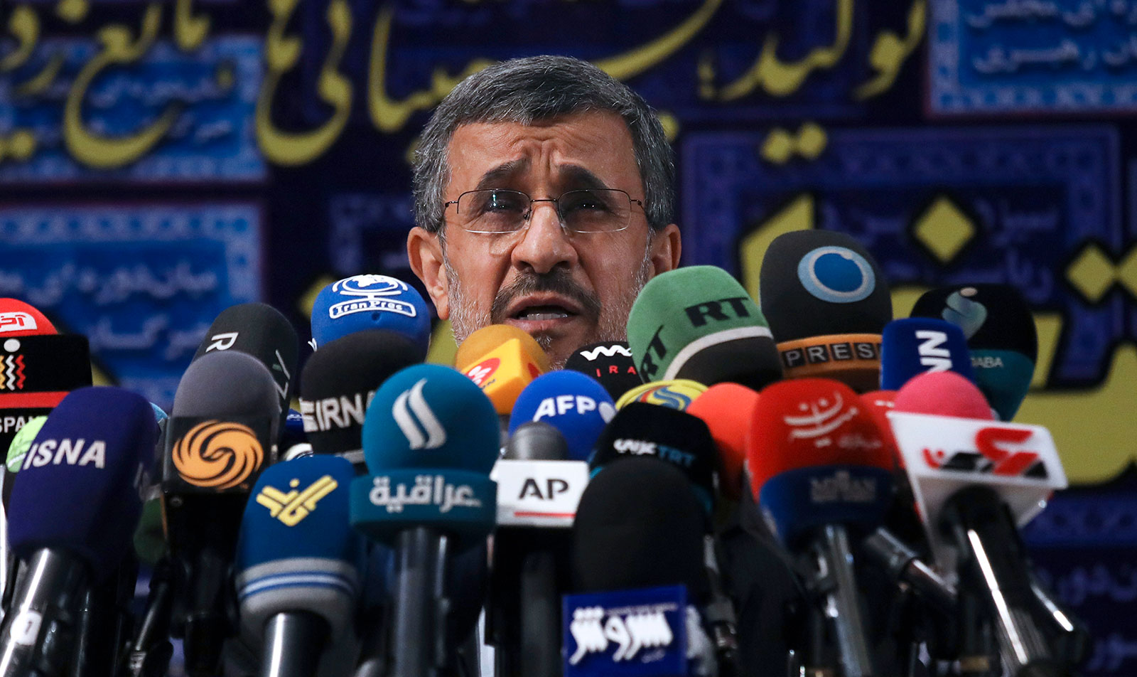 Former President Mahmoud Ahmadinejad speaks with the media in Tehran in May 2021.