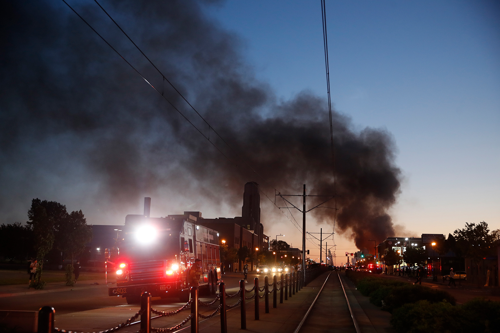 Fire burns in the distance during demonstrations on May 28, in St. Paul, Minnesota. 