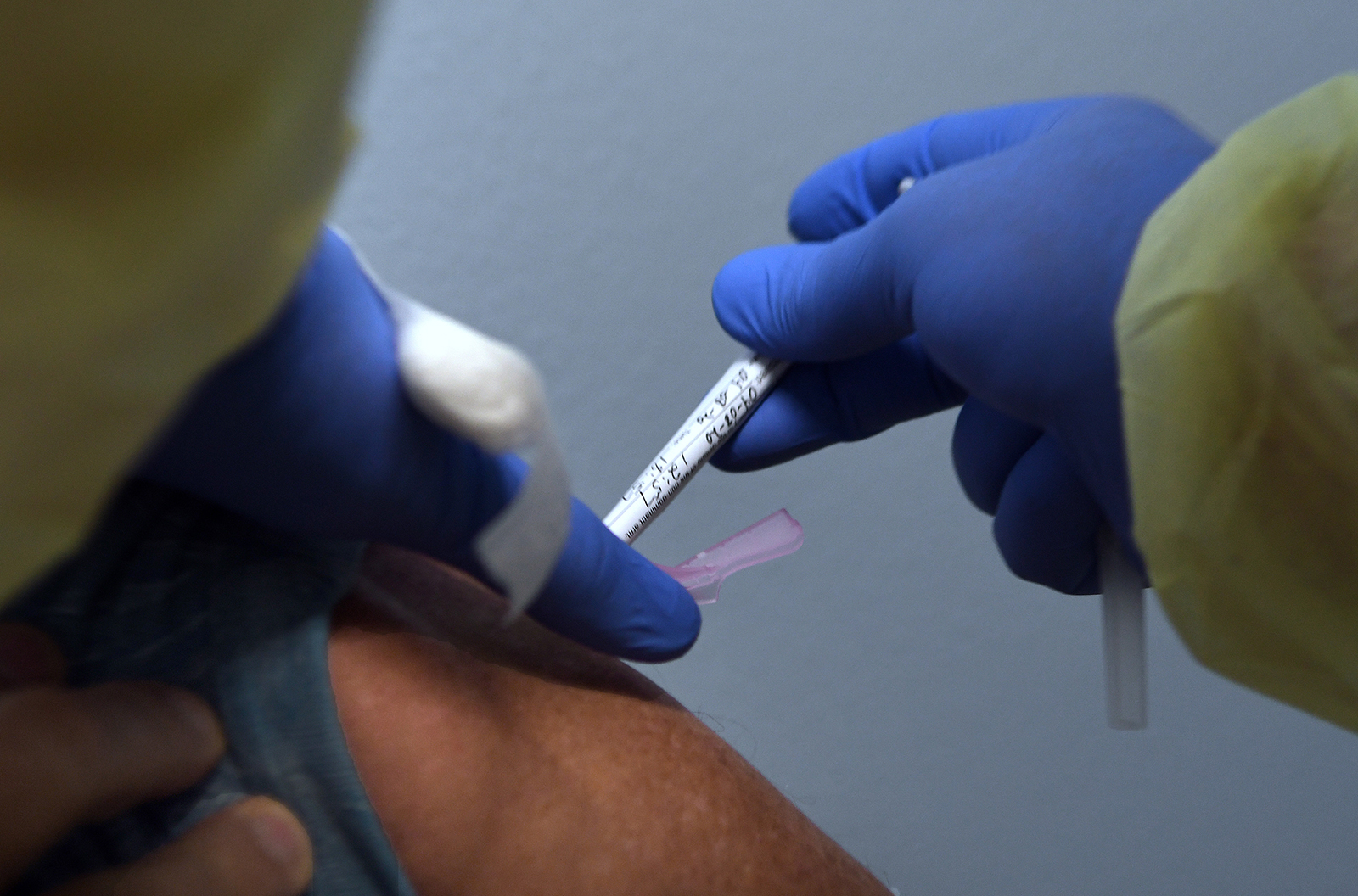 Tony Potts, a 69-year-old retiree living in Ormond Beach, receives his first injection as a participant in a Phase 3 Covid-19 vaccine clinical trial sponsored by Moderna at Accel Research Sites on August 4, 2020 in DeLand, Florida.