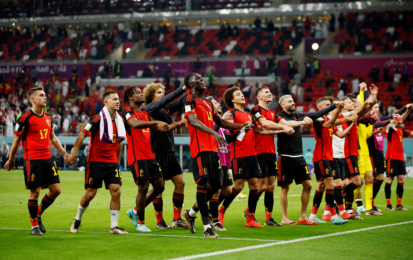 Belgium players celebrate after the match against Canada on November 23.