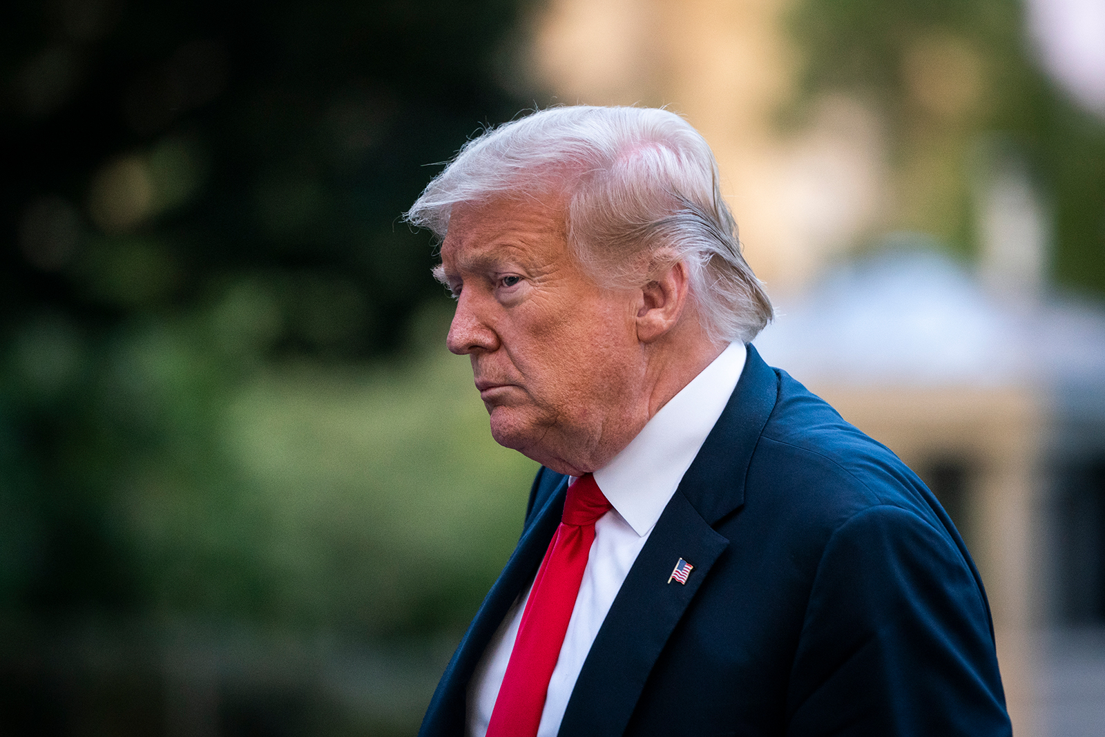 US President Donald Trump walks to the White House residence after exiting Marine One on the South Lawn on June 25, in Washington, DC. 