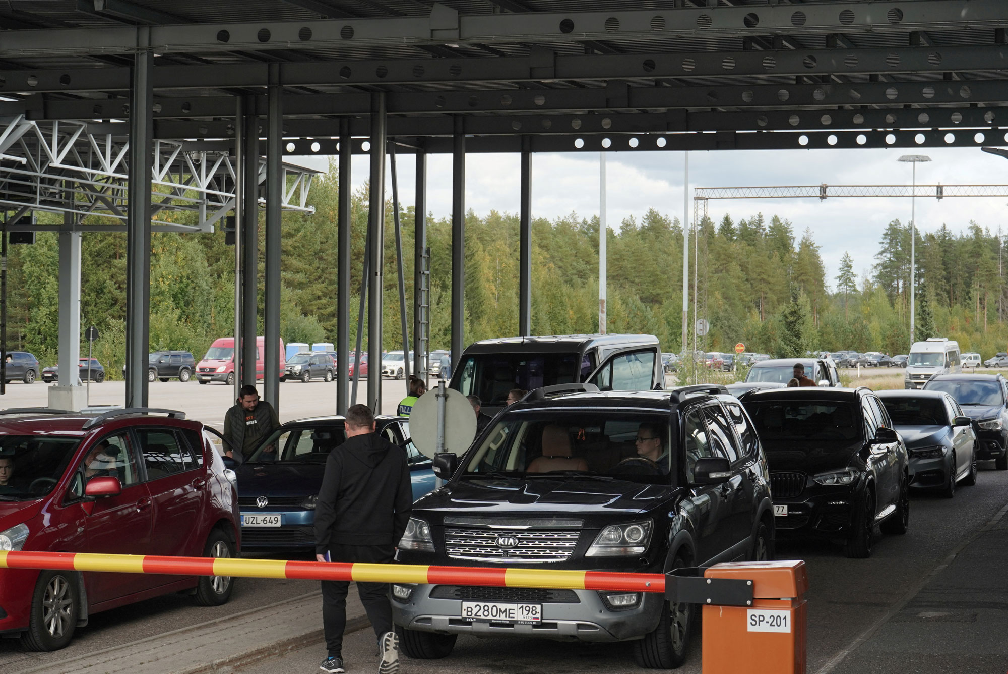 Cars queue to enter Finland from Russia at Finland's most southern crossing point Vaalimaa, on Thursday.