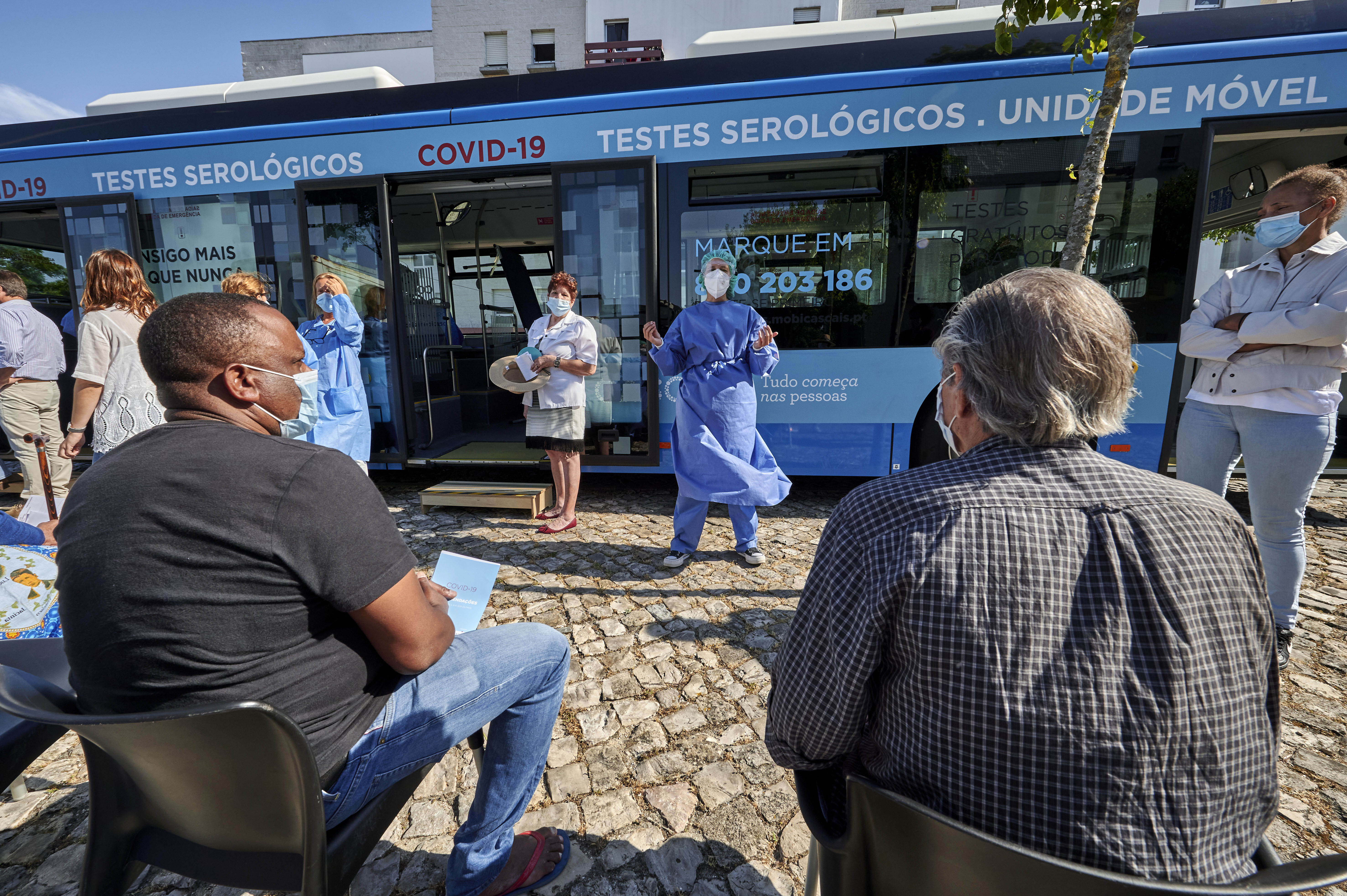 People in Cascais, Portugal, are briefed by a health technician before being tested for Covid-19 on June 23.