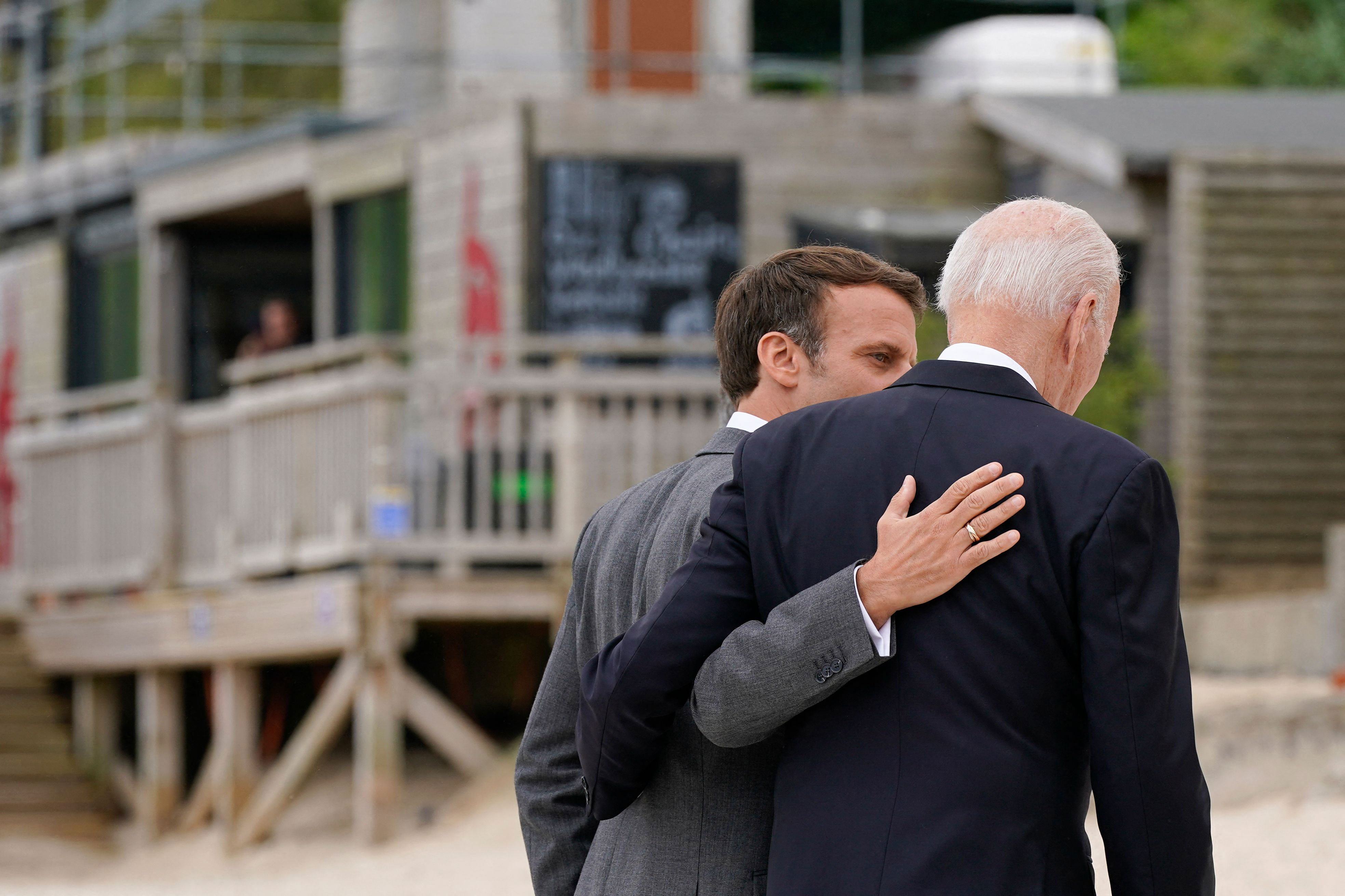 French President Emmanuel Macron walks with US President Joe Biden in Carbis Bay, England, on June 11.