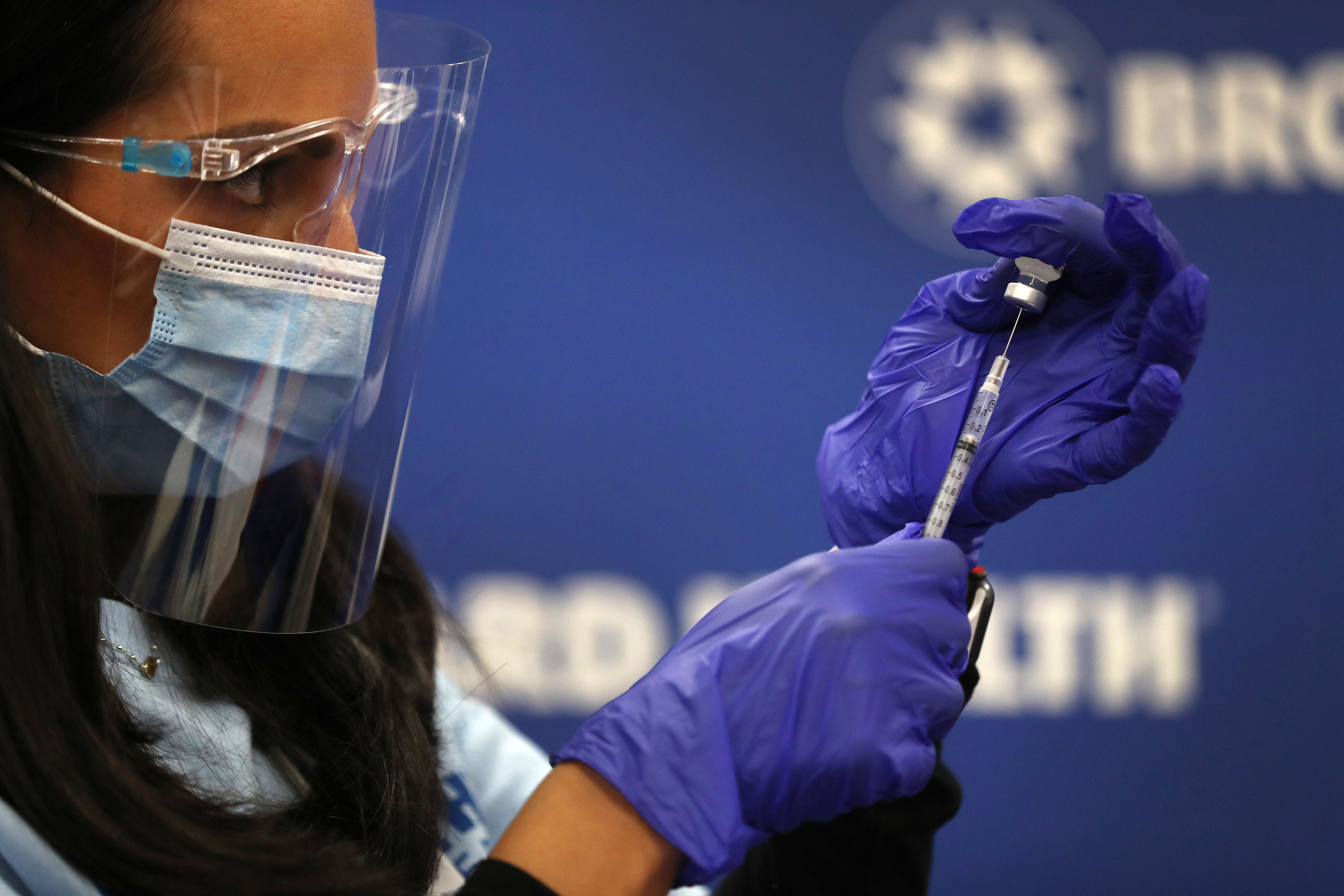 A nurse practitioner from Broward Health Medical Center prepares a Pfizer/BioNTech Covid-19 vaccine on December 17 in Fort Lauderdale, Florida.