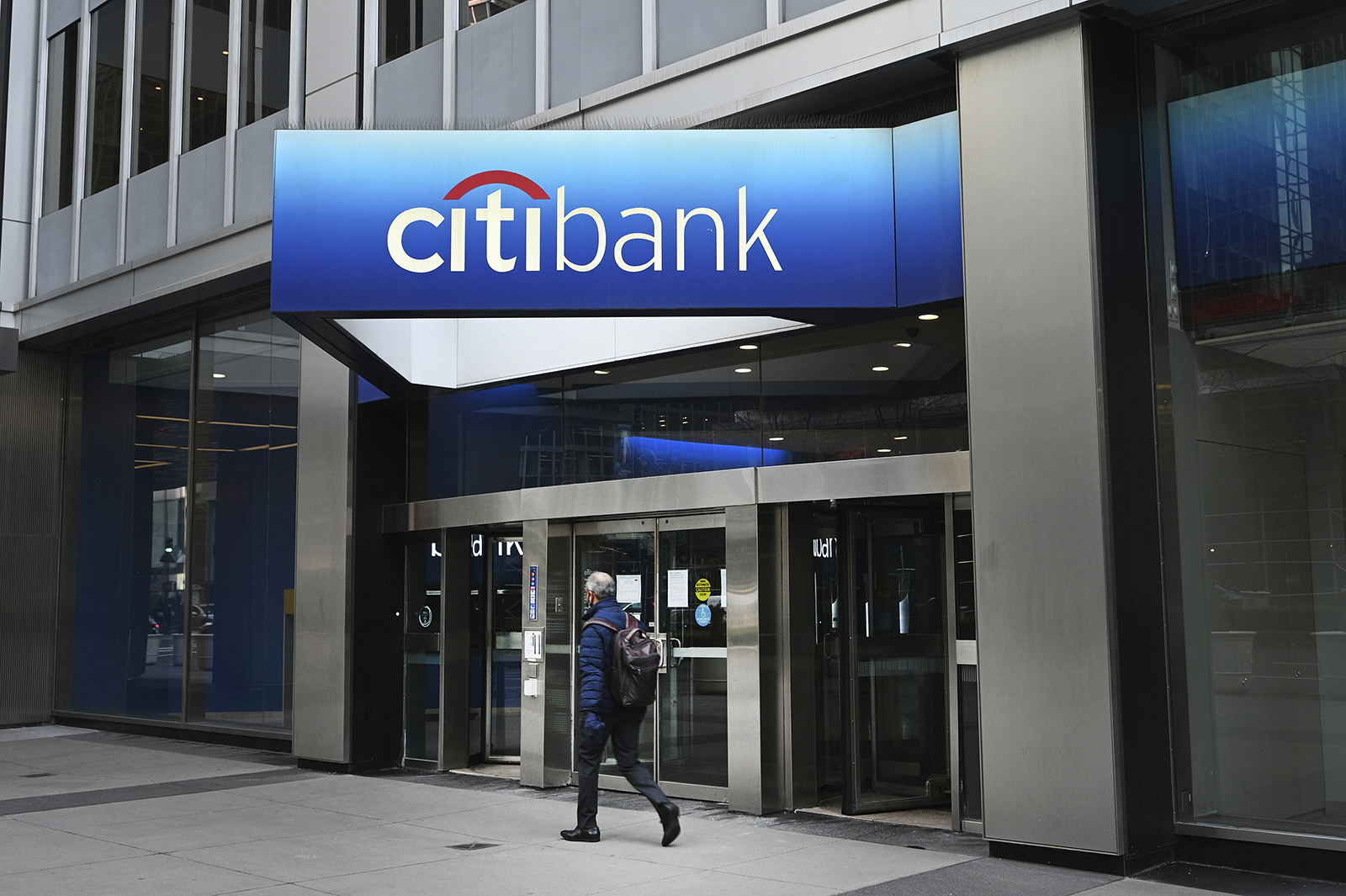 A man walks past a Citigroup Citibank Park Avenue branch in New York, NY, January 13