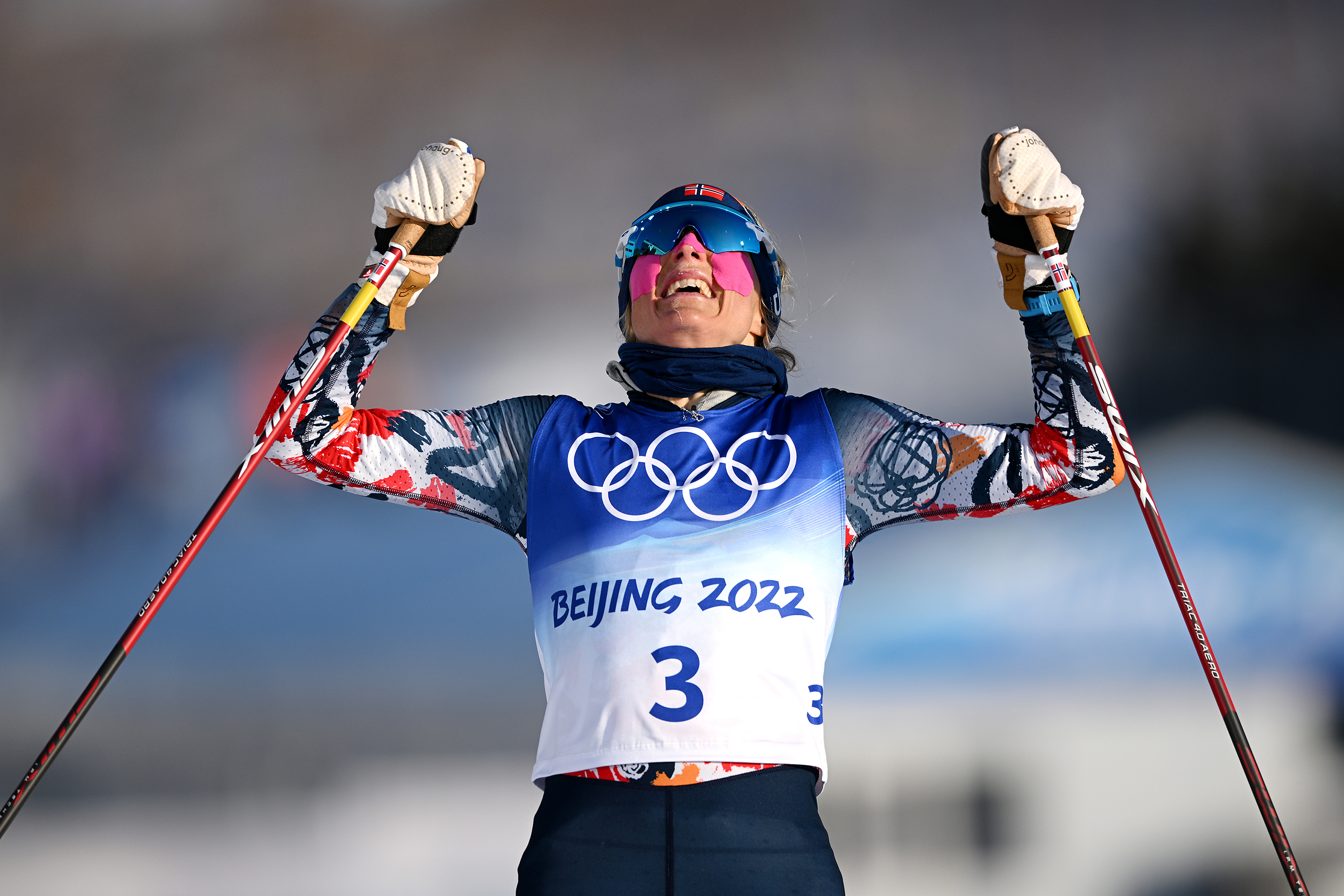 Norway's Therese Johaug celebrates after winning the women's skiathlon 2x7.5km event on February 5 at the Zhangjiakou National Cross-Country Skiing Centre. 