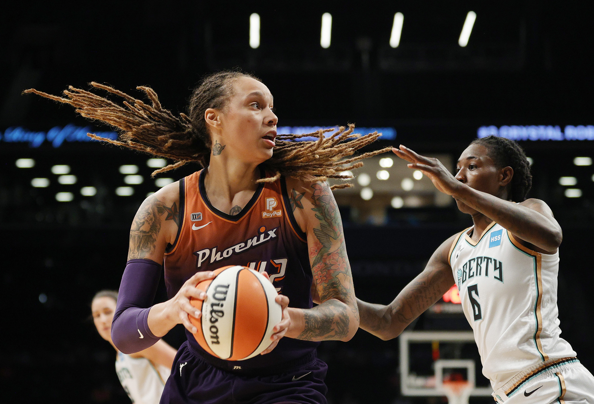 Brittney Griner #42 of the Phoenix Mercury drives to the basket as Natasha Howard #6 of the New York Liberty defends, at the Barclays Center, New York, on August 25.