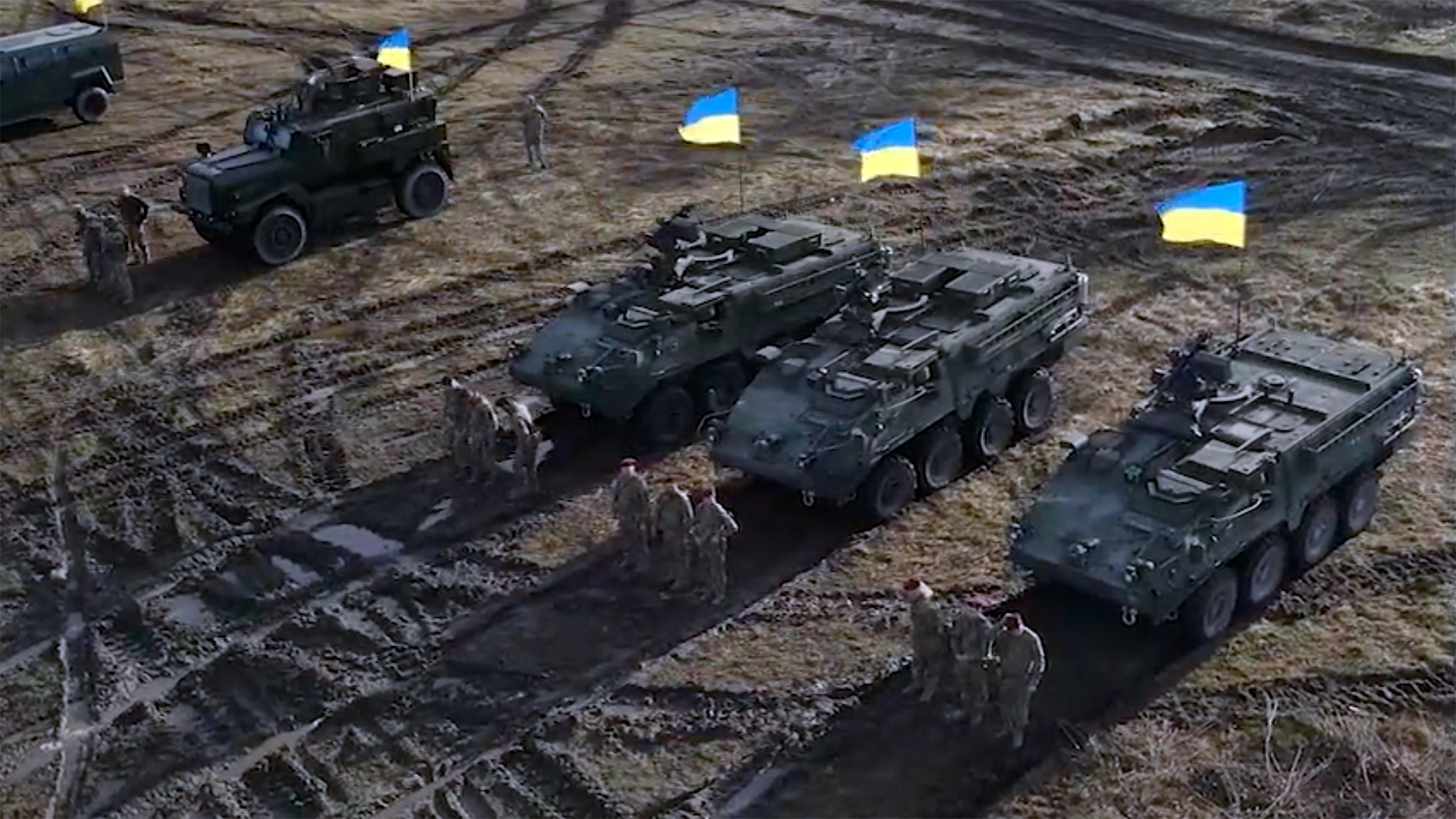 In this screengrab from a video posted on Twitter, Ukraine’s Air Assault Forces stands with US-provided Stryker and Cougar fighting vehicles.