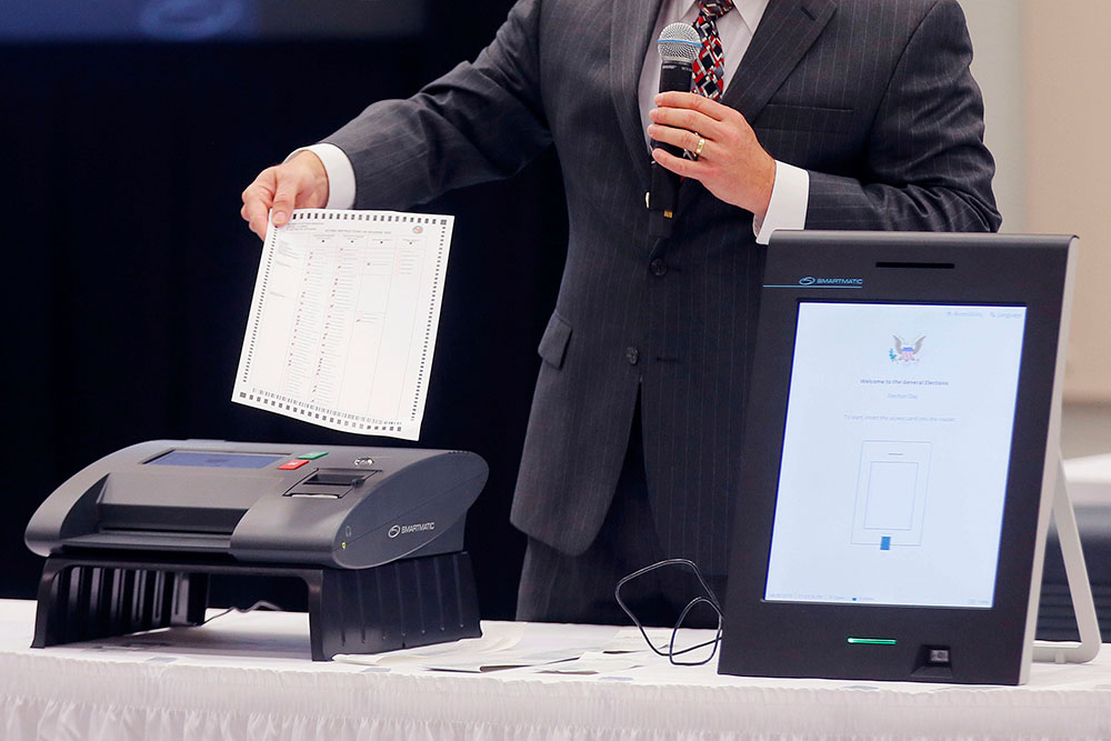 Smartmatic representative demonstrates his company's system on August 30, 2018, at a meeting of the Secure, Accessible & Fair Elections Commission in Grovetown, Georgia. 