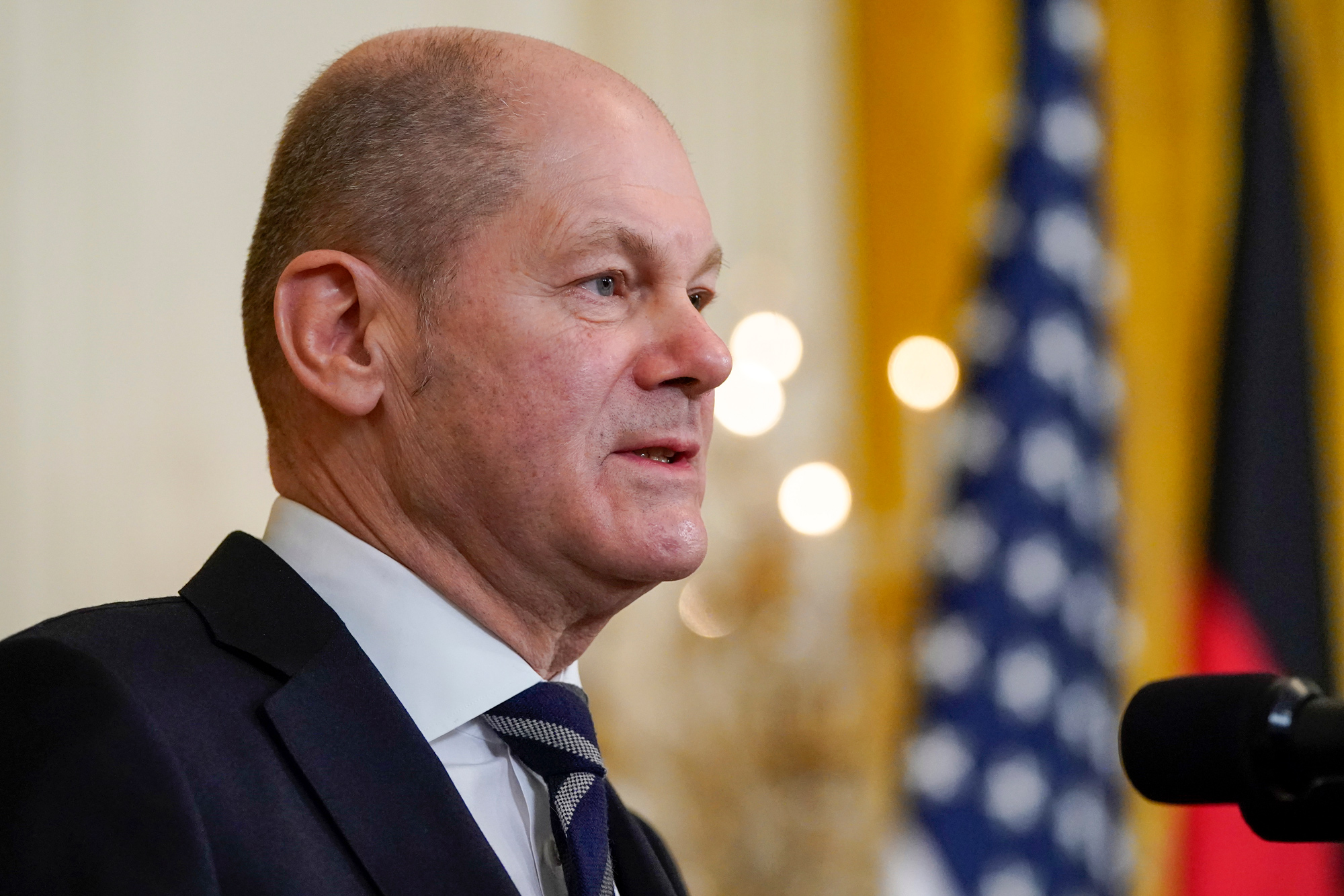 German Chancellor Olaf Scholz speaks during a news conference with President Joe Biden in the East Room of the White House on February 7 in Washington, DC.