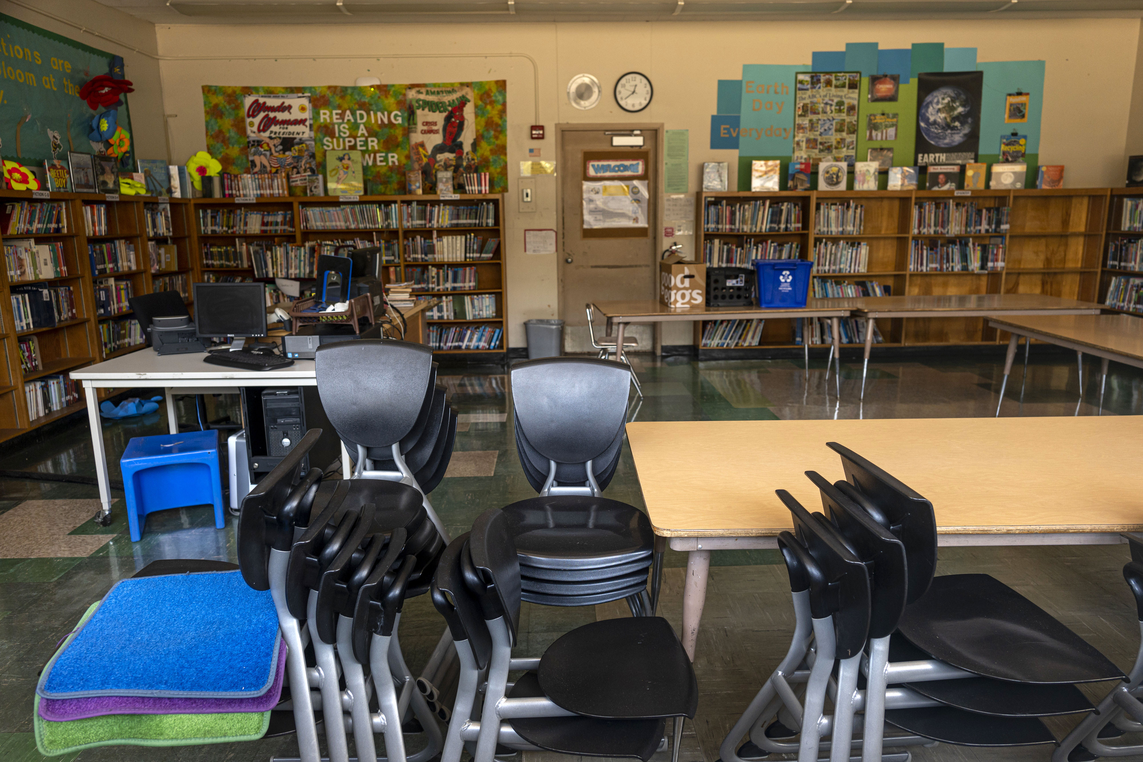 Chairs are stacked inside an empty classroom at Collins Elementary School in Pinole, California, in December 2020.