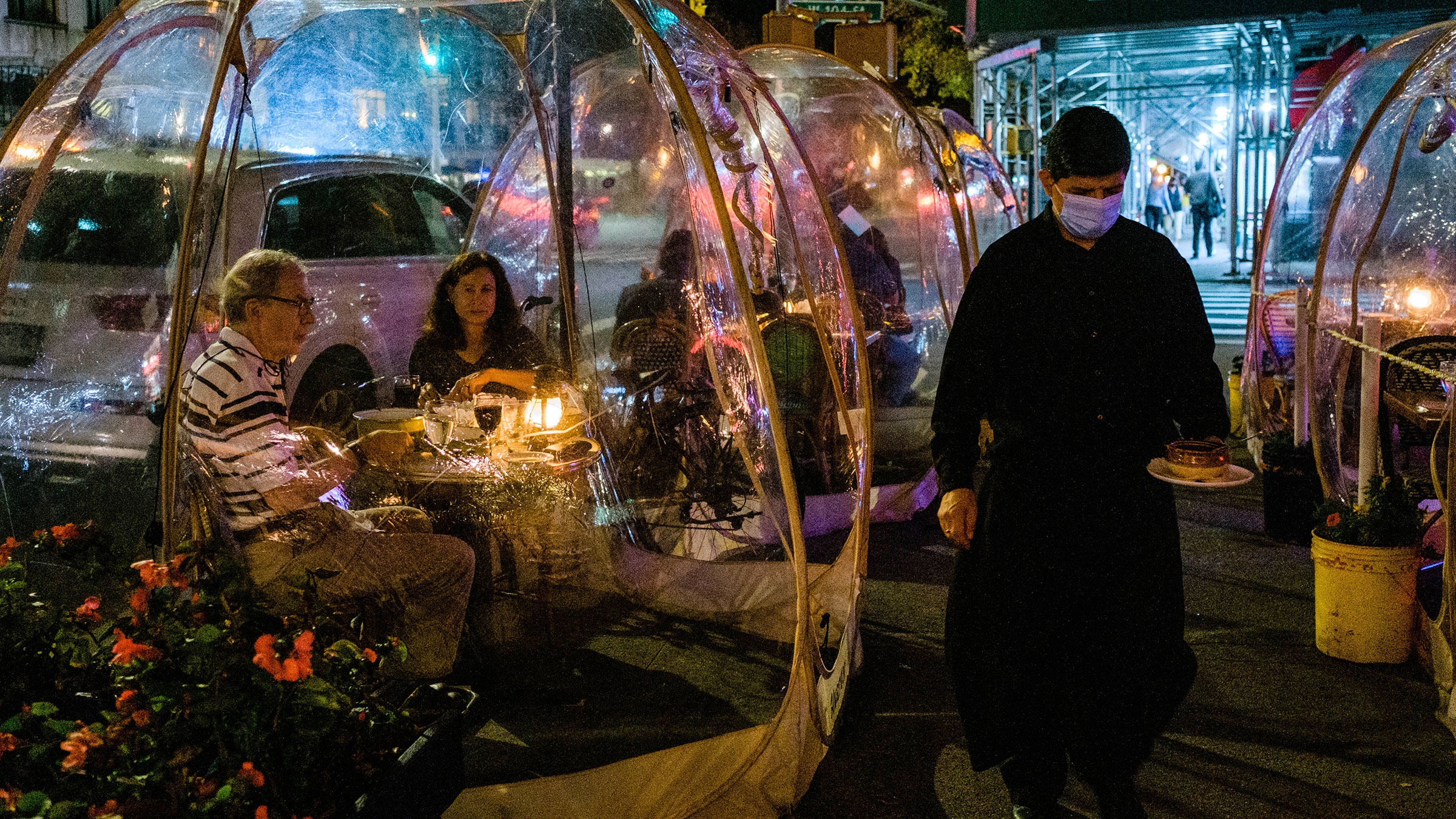 Customers dine in bubble tents at a restaurant in New York on November 10.