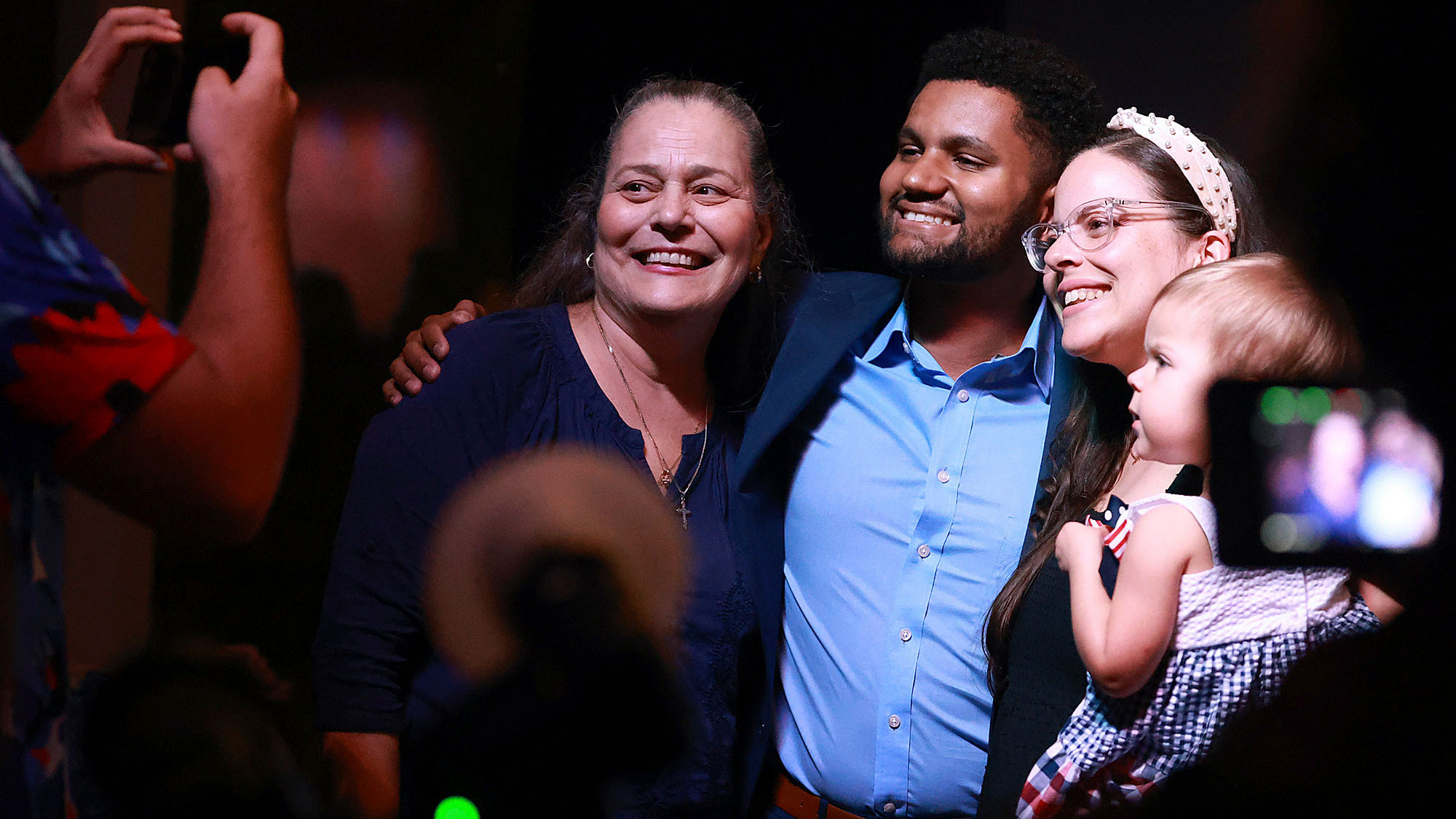 Maxwell Frost poses with supporters during a victory party in Orlando. Frost, a 25-year-old Democrat, is projected to win the open House seat in Florida's 10th Congressional District. That would make him the first member of Generation Z elected to Congress. Members of Gen Z — those born after 1996 — are now old enough to be elected to the House.