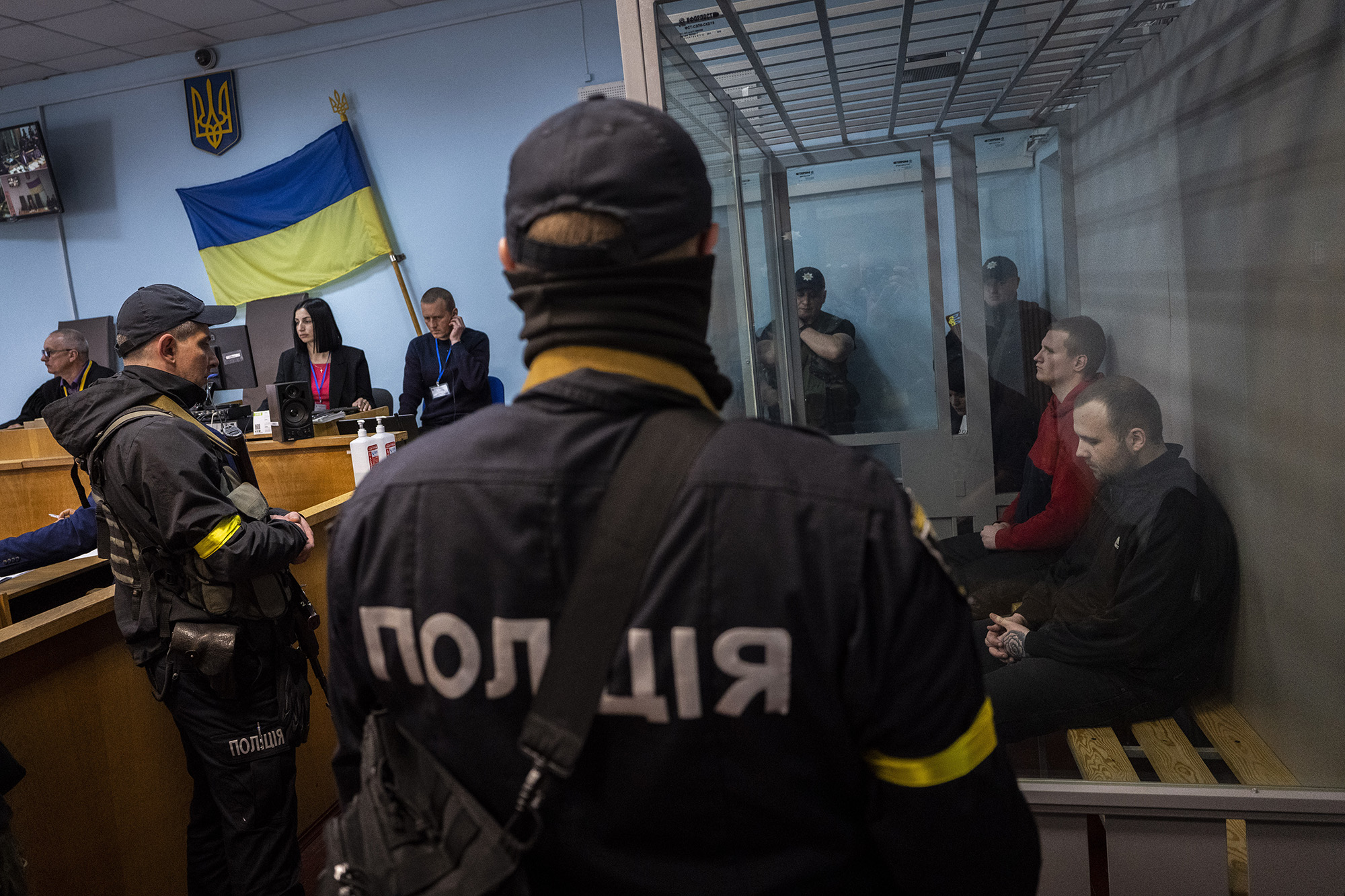 Russian soldiers Oleksandr Ivanov and Oleksandr Bobykin, right, attend their trial hearing in Kotelva, northeastern Ukraine, on May 26.