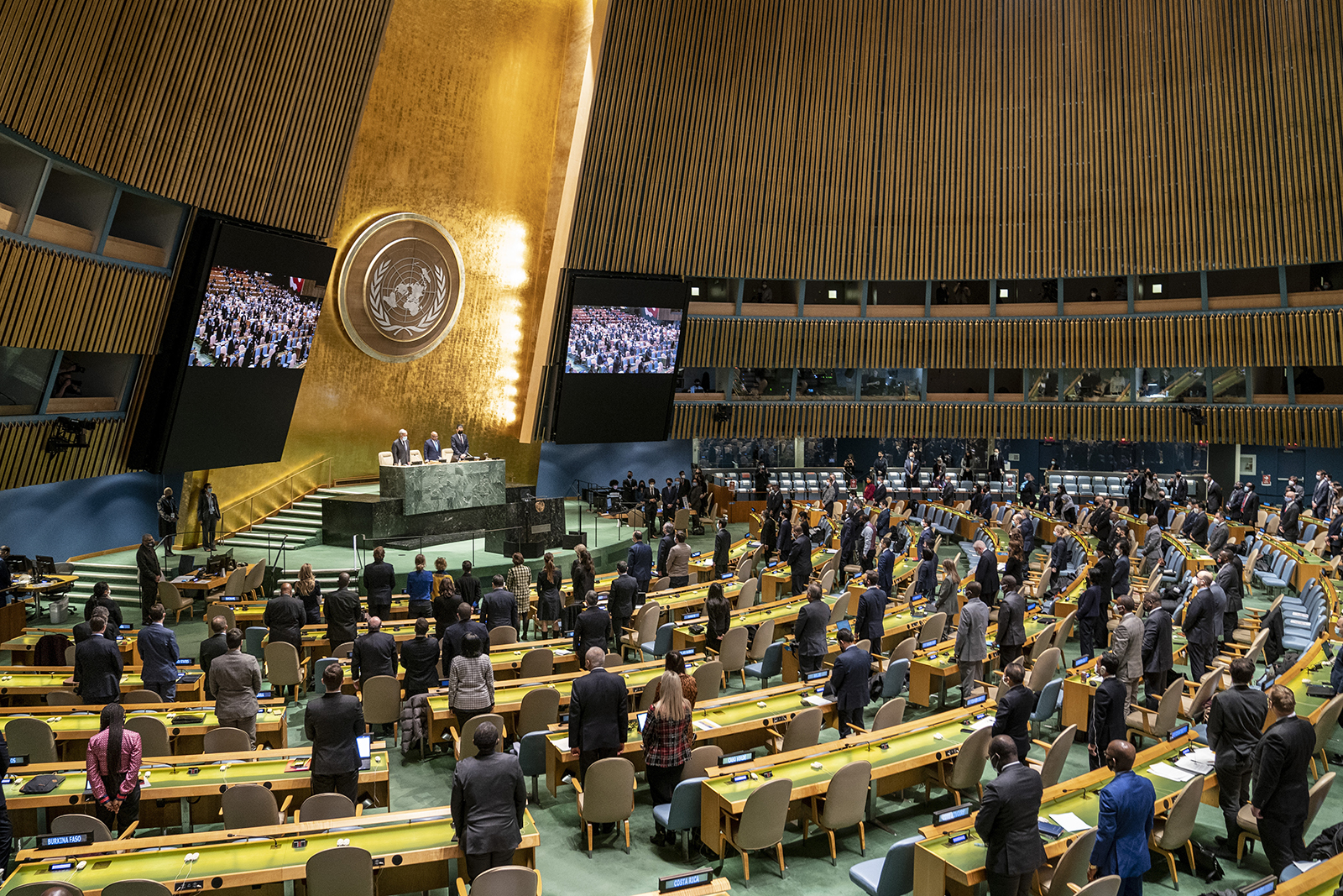 Delegates stand for a moment of silence during an emergency session of the UN General Assembly, on February 28, at the United Nations Headquarters in New York.