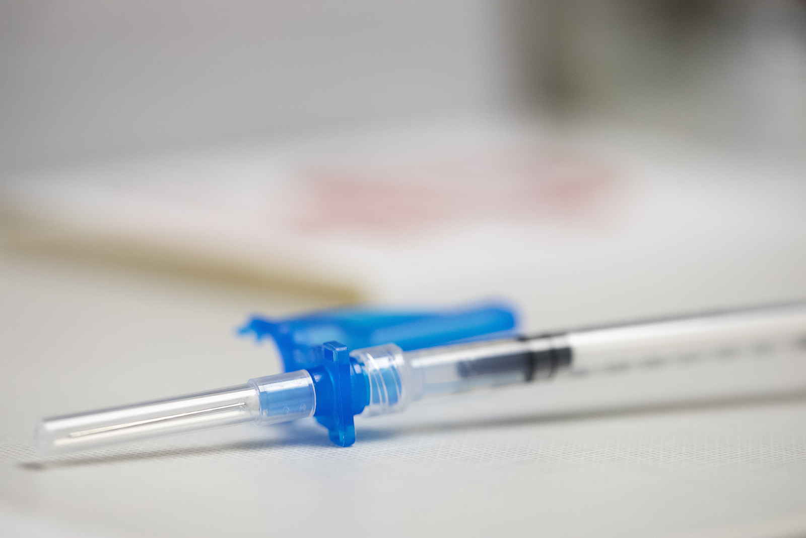 A syringe is prepped for a Moderna COVID-19 booster vaccine at a pharmacy in Portland, Oregon on Monday Dec. 27.