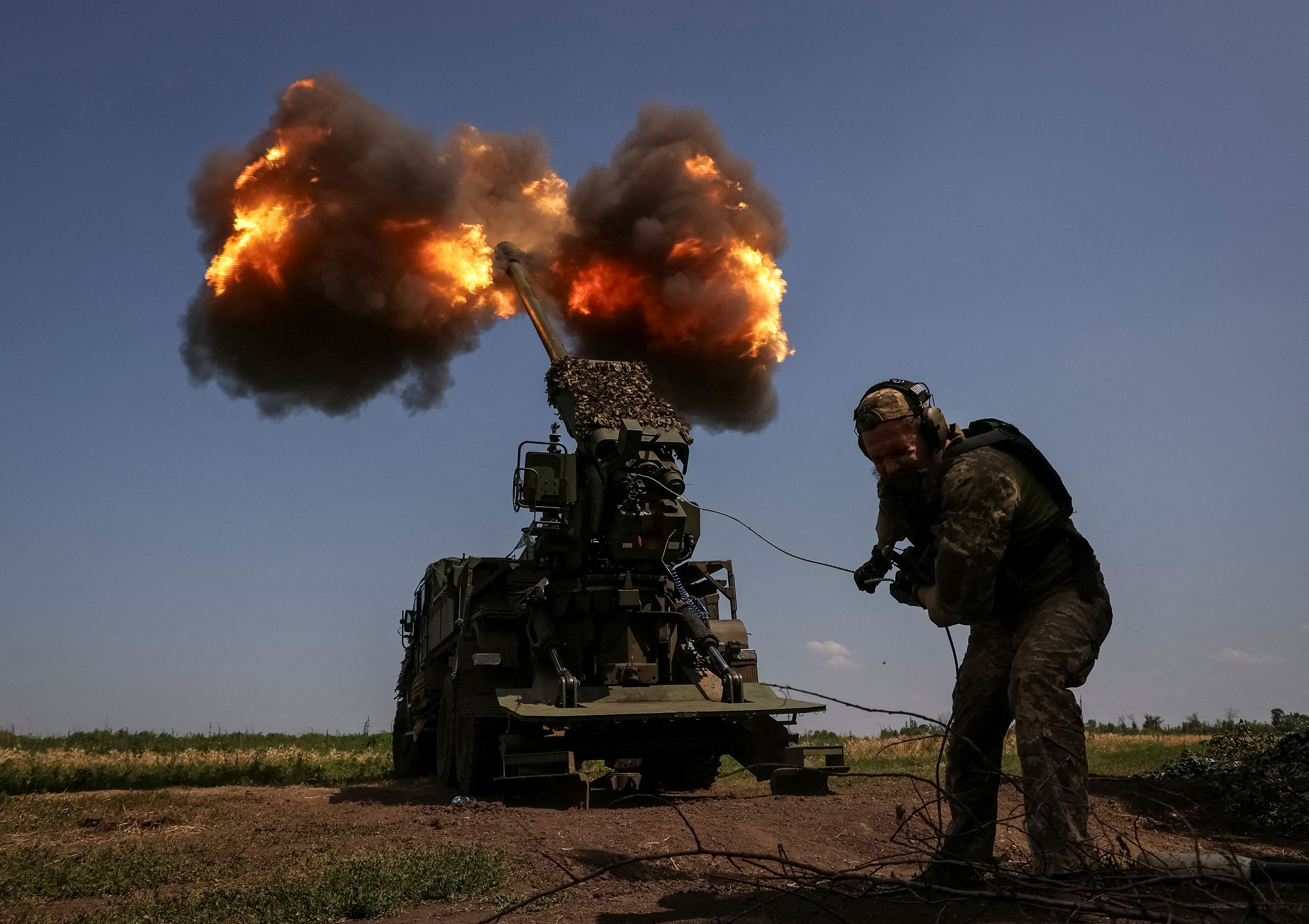 A Ukrainian soldier fires toward Russian troops near Bakhmut, Ukraine, on July 5.