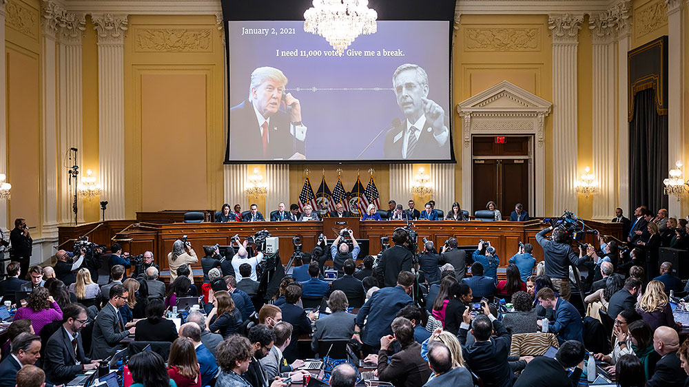 A video of former President Donald Trump is shown on a screen, as the House select committee investigating the January 6 attack on the U.S. Capitol holds its final meeting on Capitol Hill in Washington, DC,  Monday, December 19. (